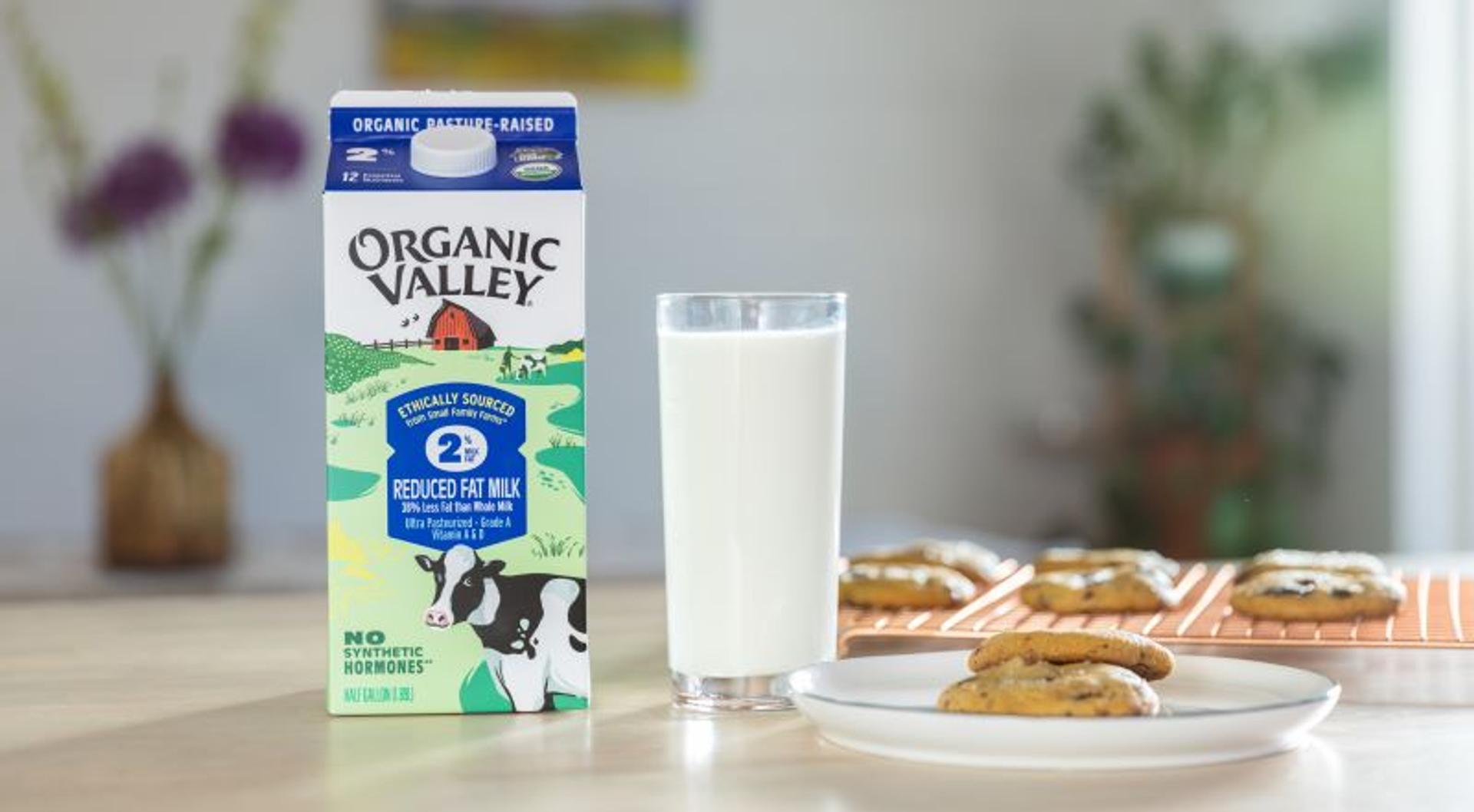 A carton of Organic Valley Milk next to cookies.