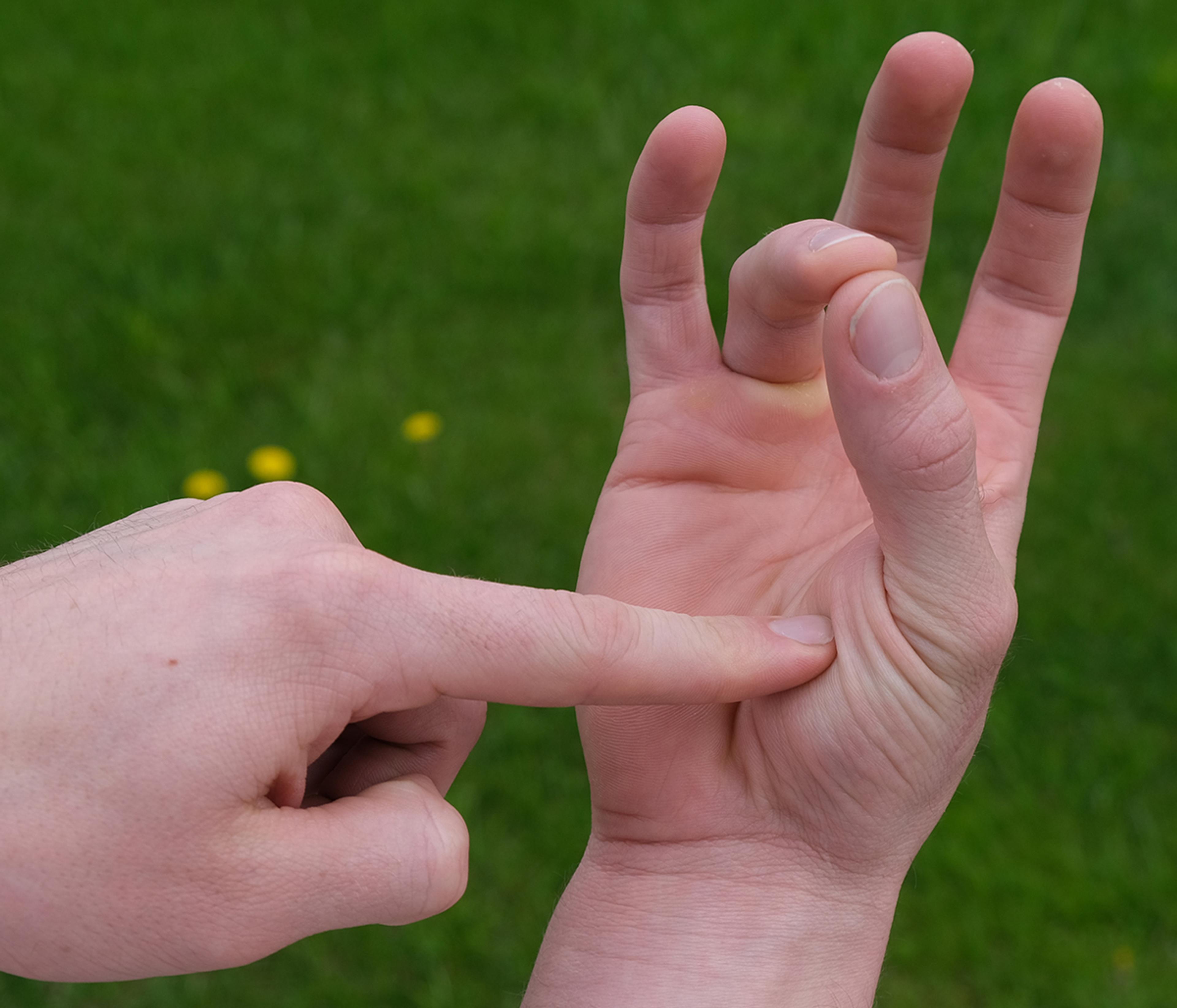 A man puts his fingers together.