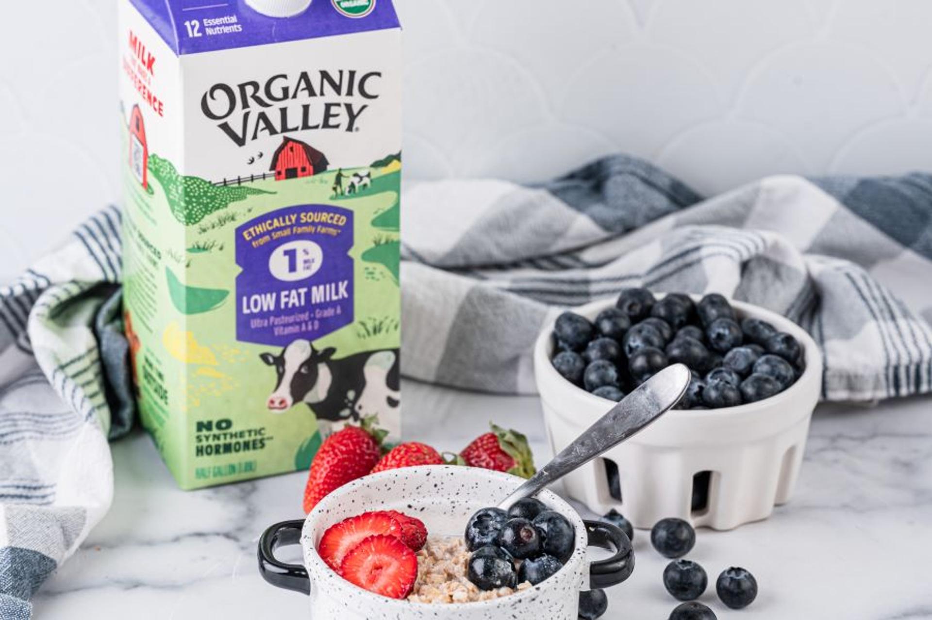 Oatmeal with strawberries, blueberries and organic milk.