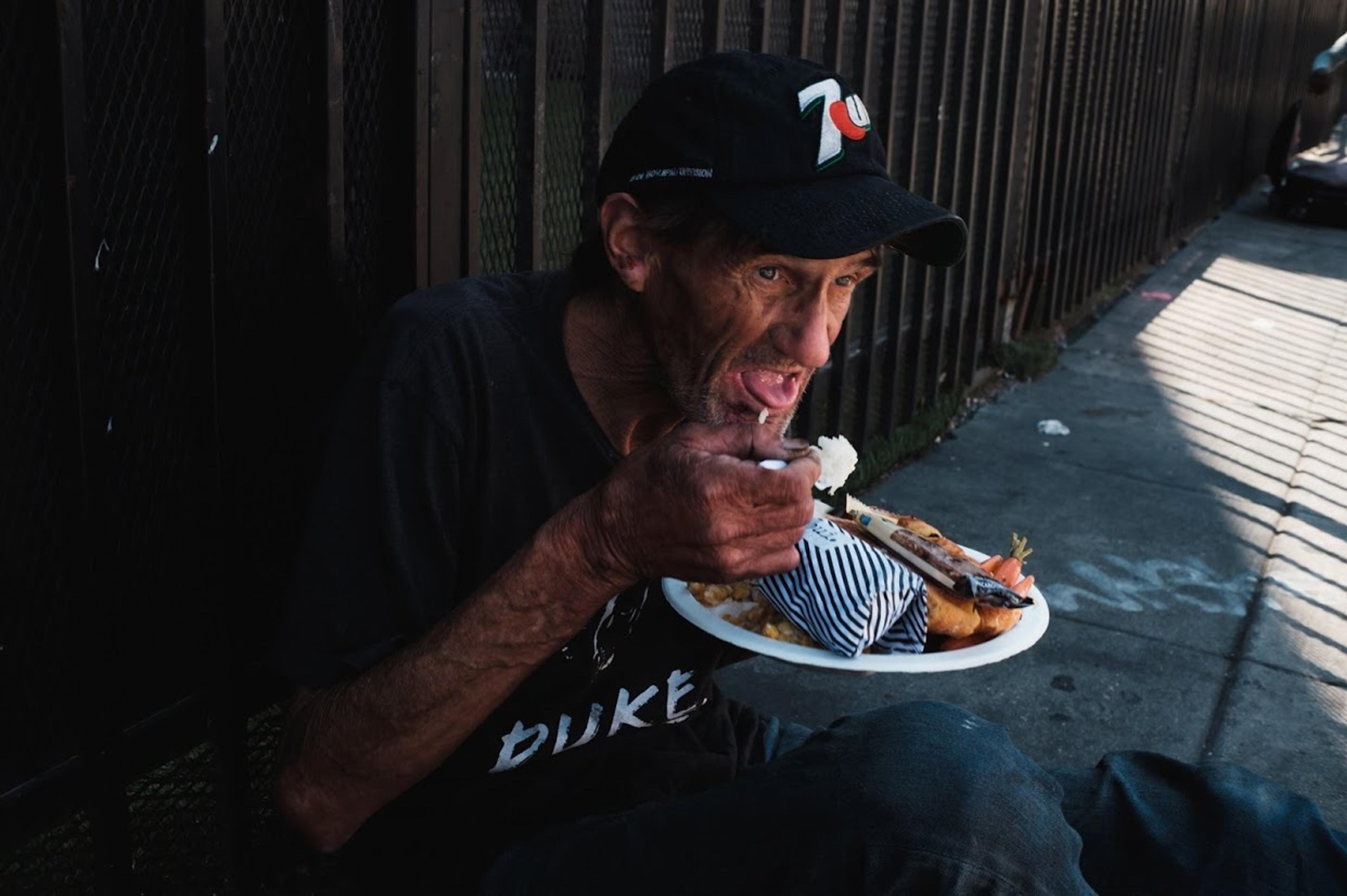 Man receives meal on street