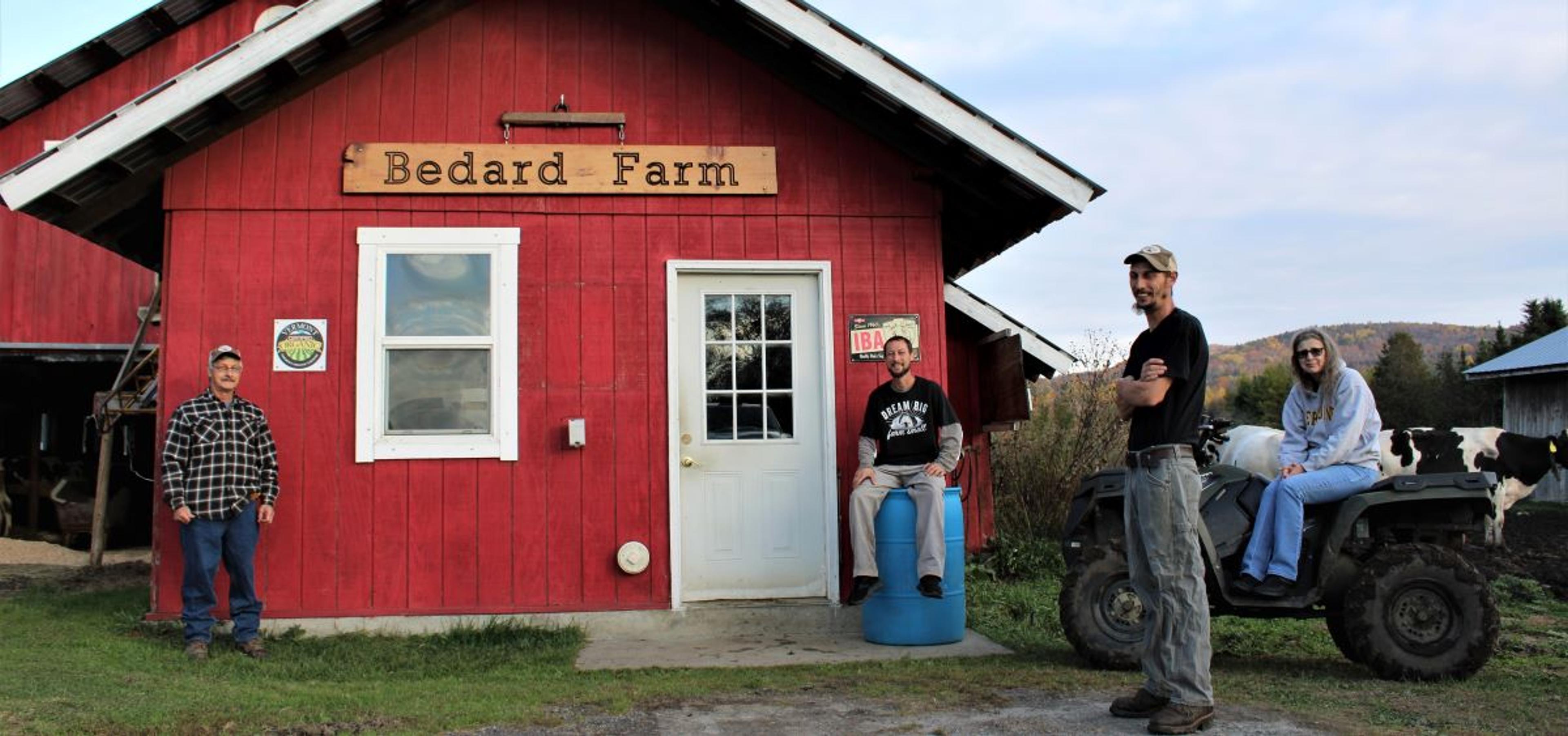 The family stands by their milkhouse.