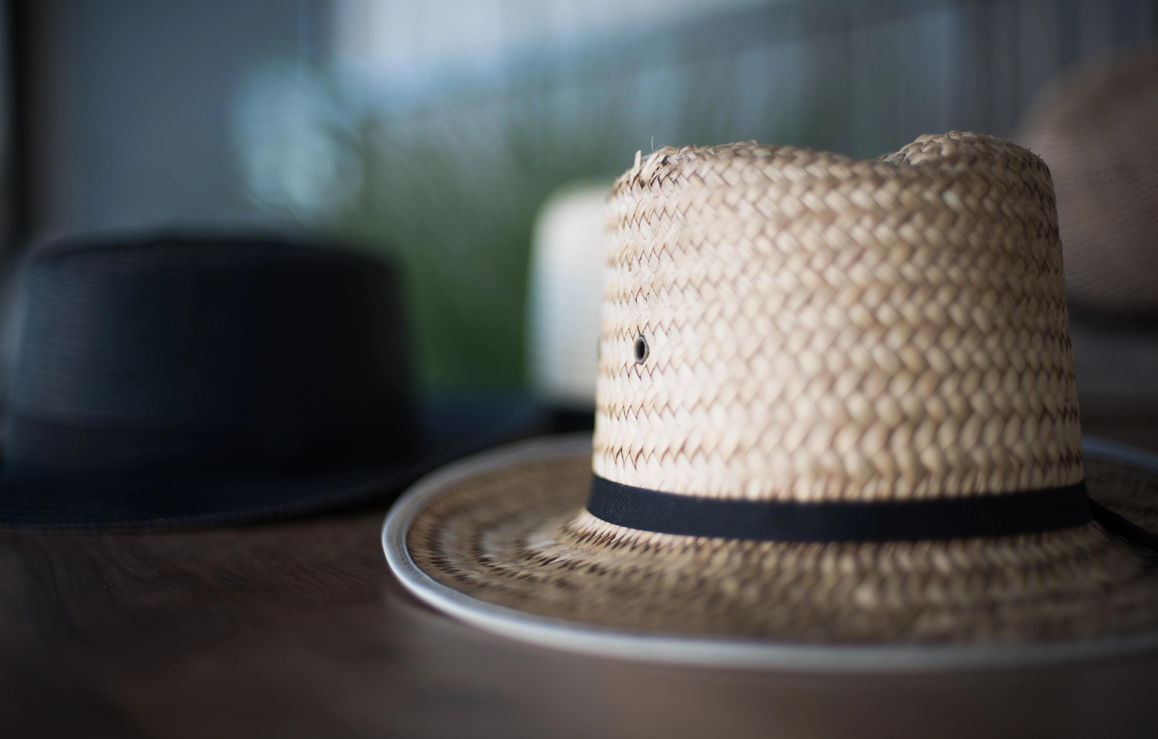 A Plain community member's straw hat on a shelf.