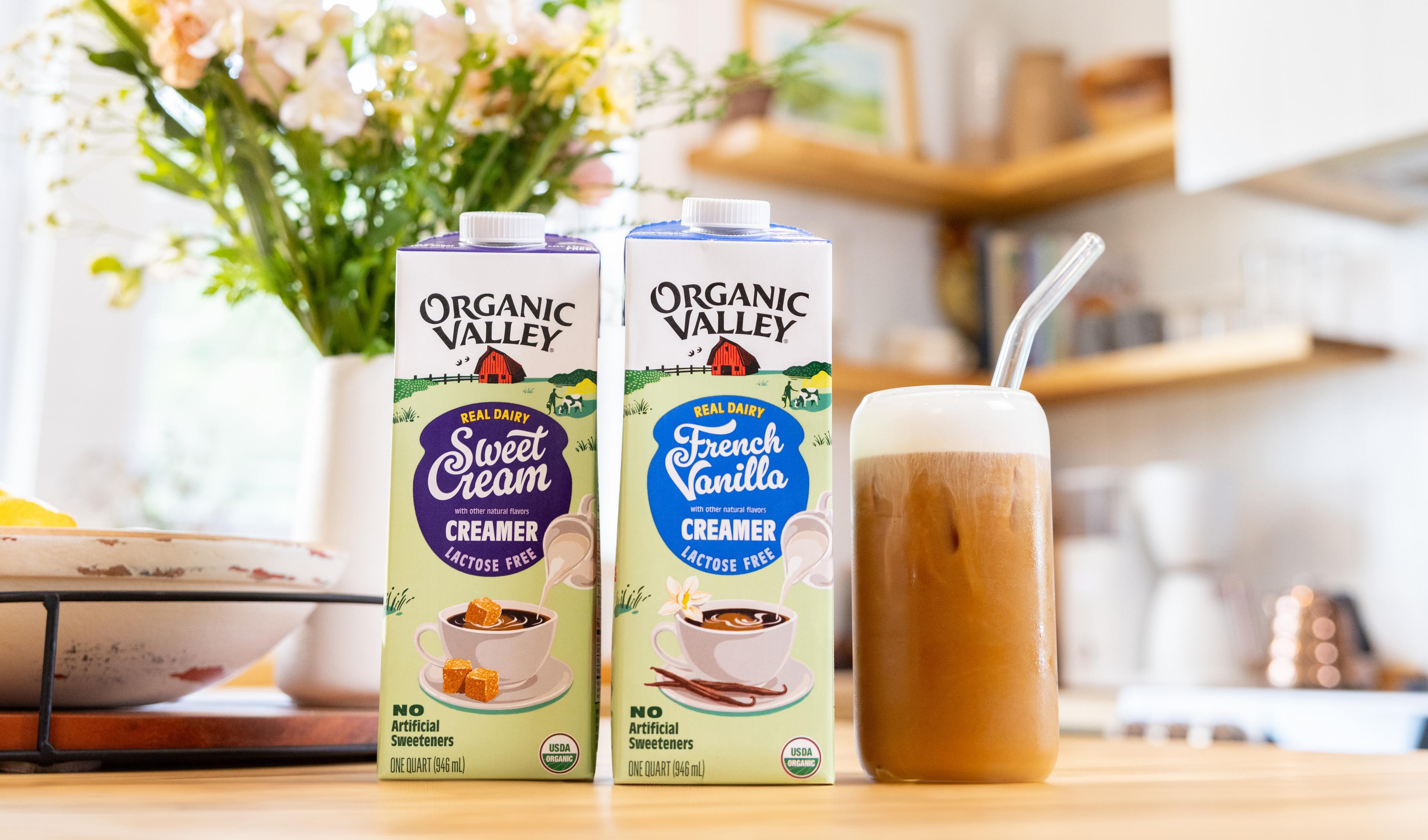 New Organic Valley lactose-free creamers on a counter with a creamer mocktail.