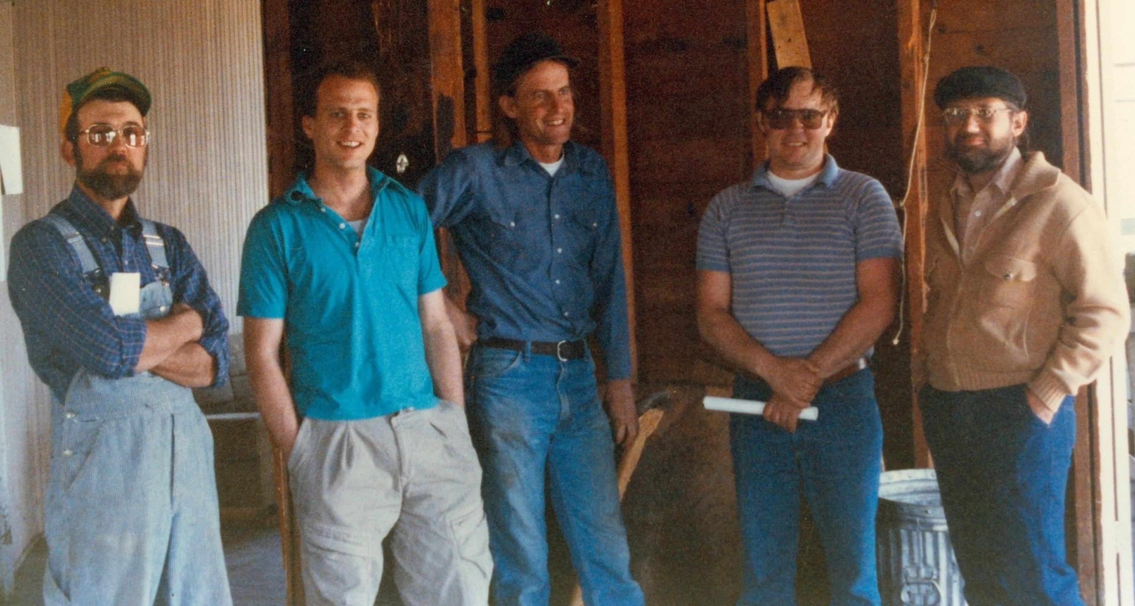 Organic Valley founders Jim Wedeberg, Greg Welch, George Siemon and Spark Burmaster talk to a man (second from right) about purchasing a building in the early days of the co-op.