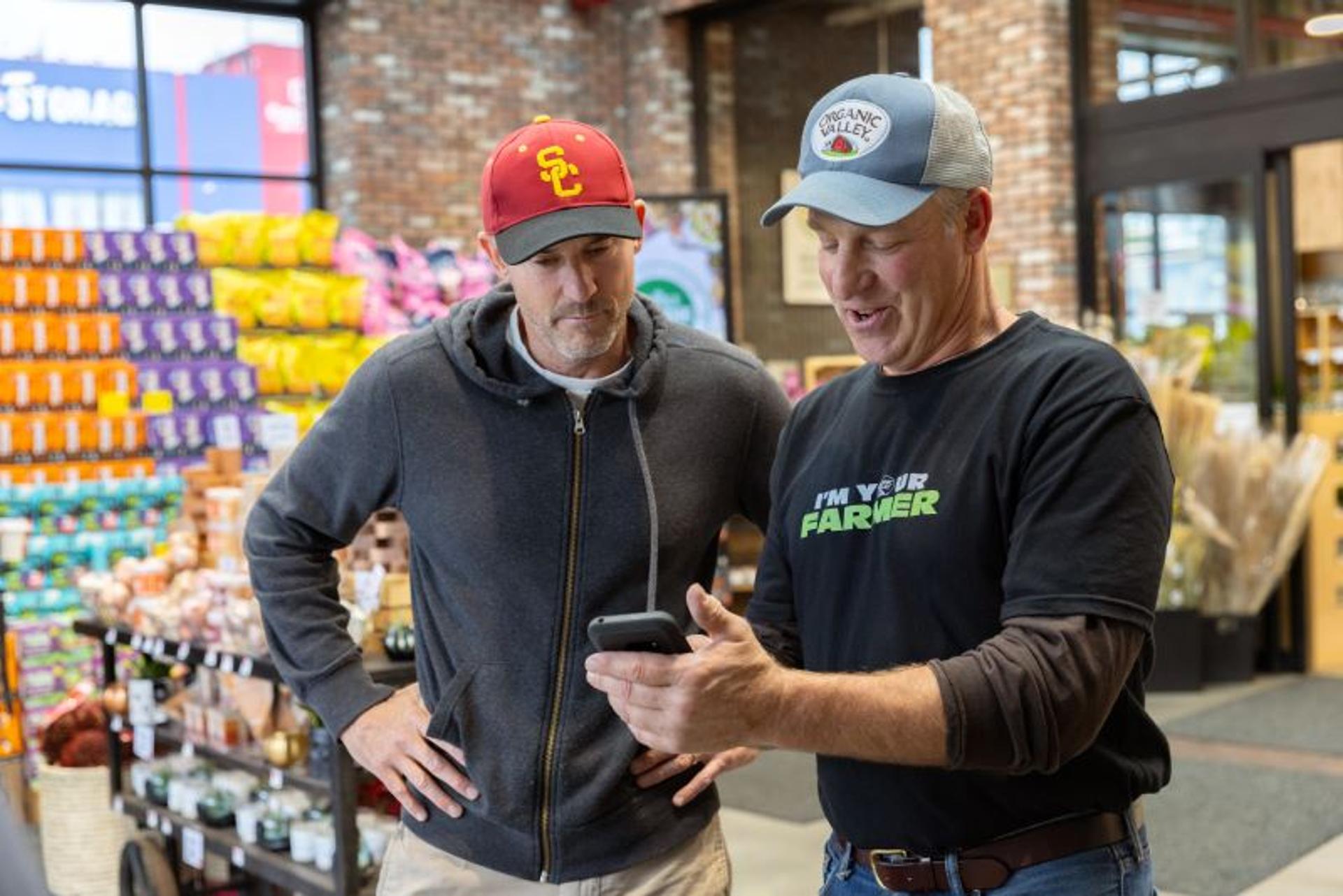 Dan Casler talks to a consumer at a grocery store in New York. 
