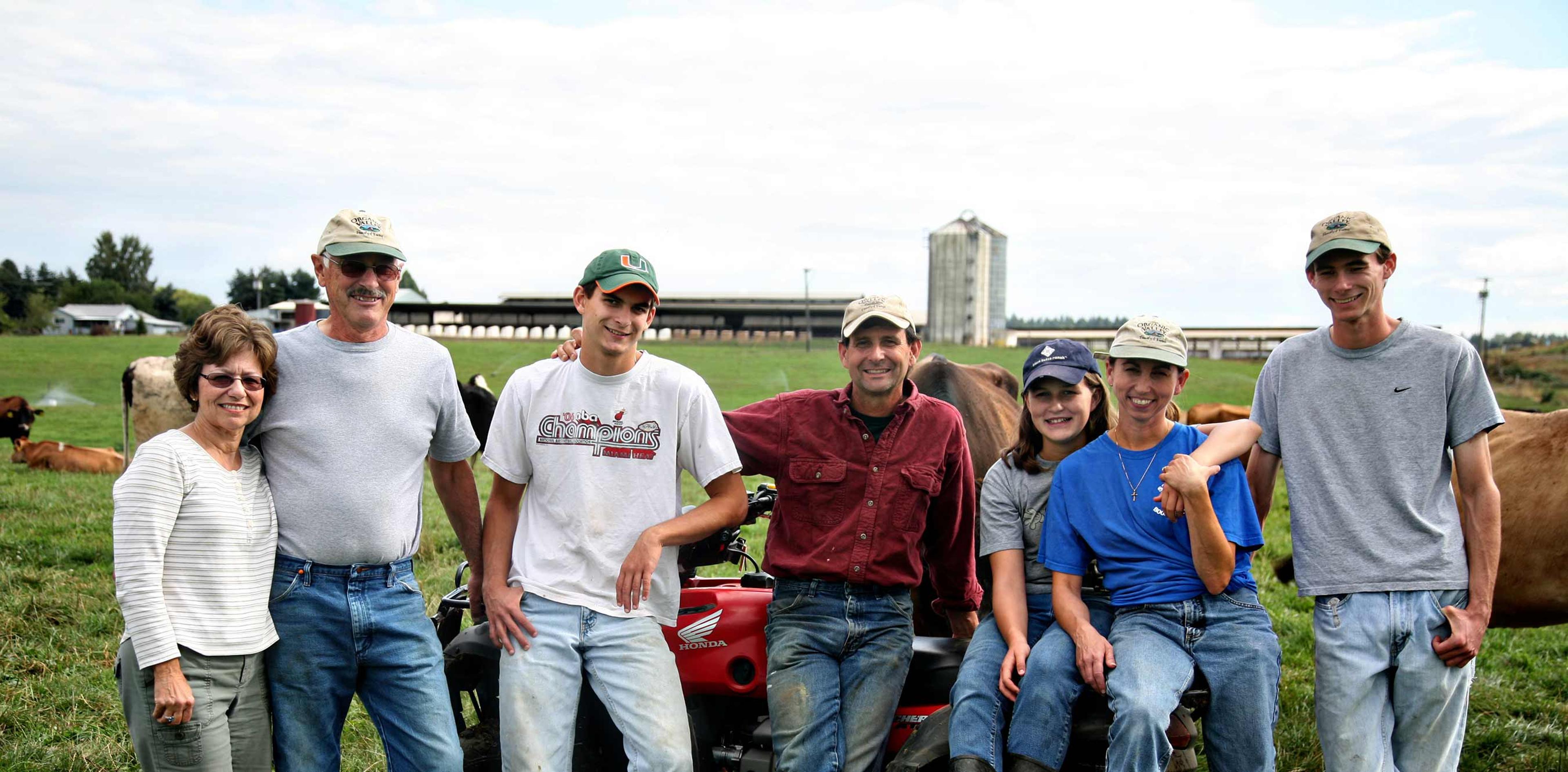 The Pierson family standing together on their farm, Sar-Ben Farms Inc., in St. Paul, OR.