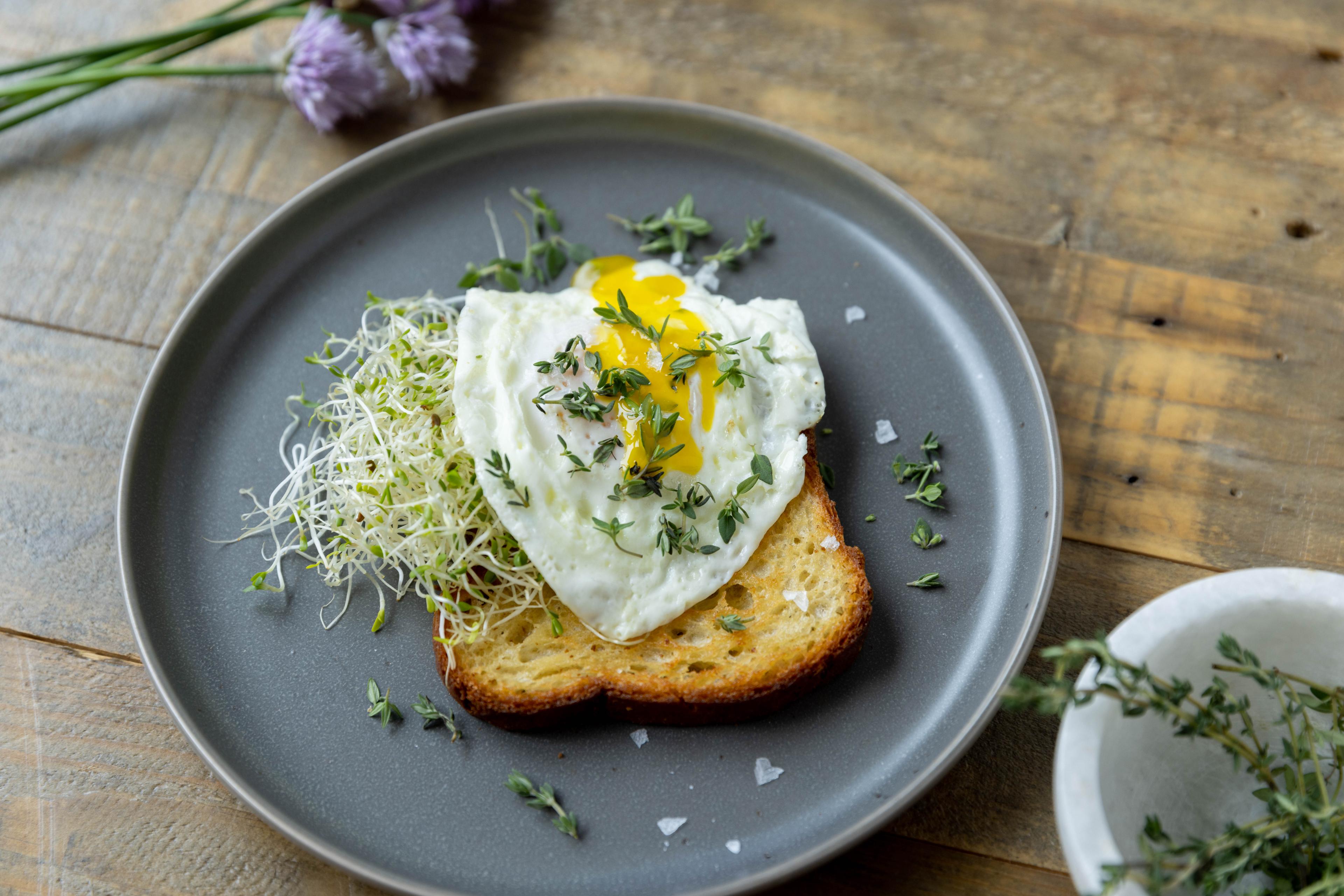 Thyme sprinkled on an over easy egg.