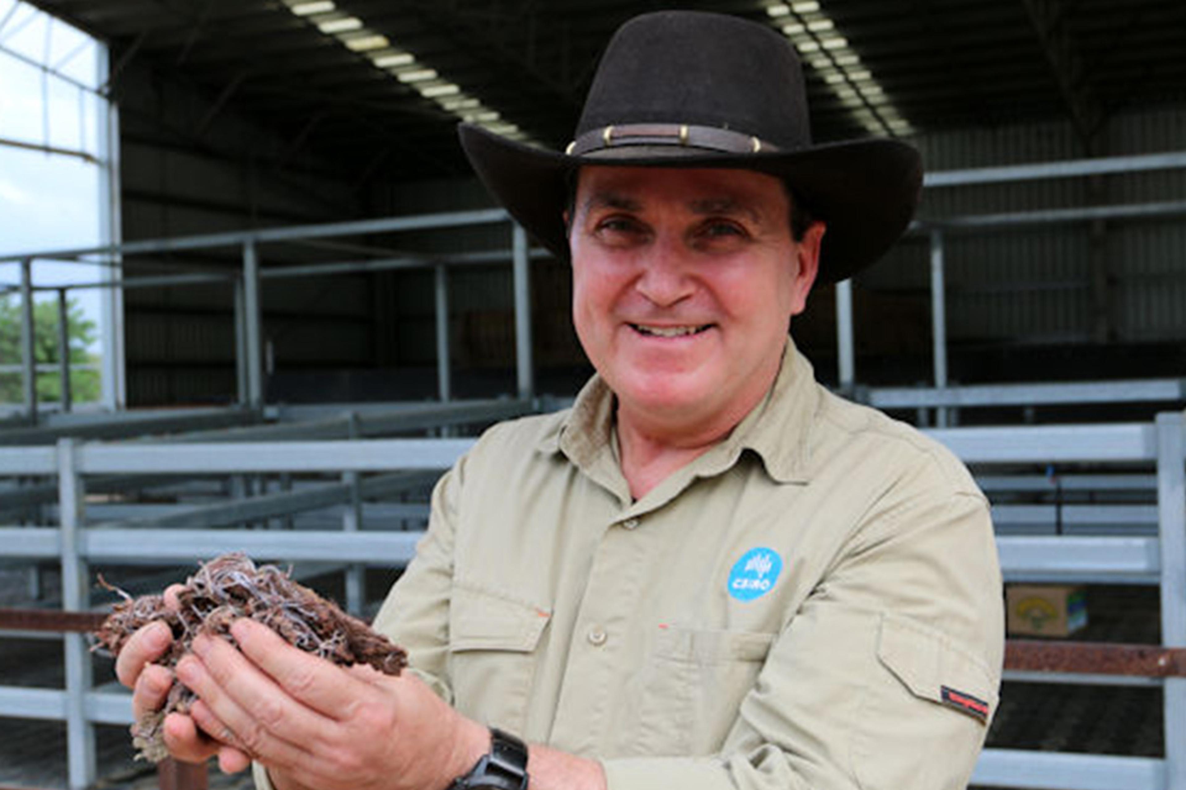 Dr. Robert Kinley holds seaweed.