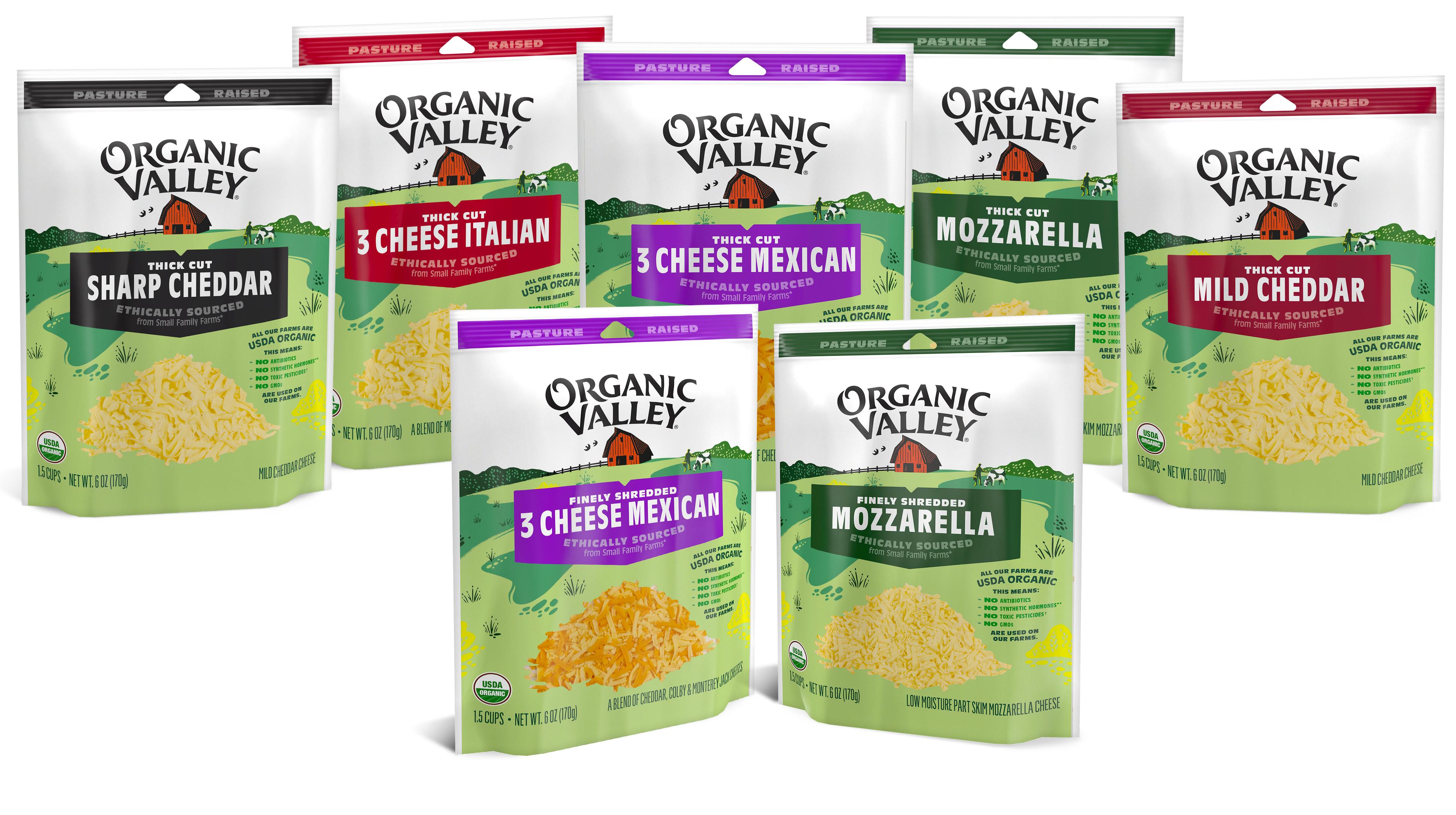 Seven packages of different types of Organic Valley shredded cheeses.