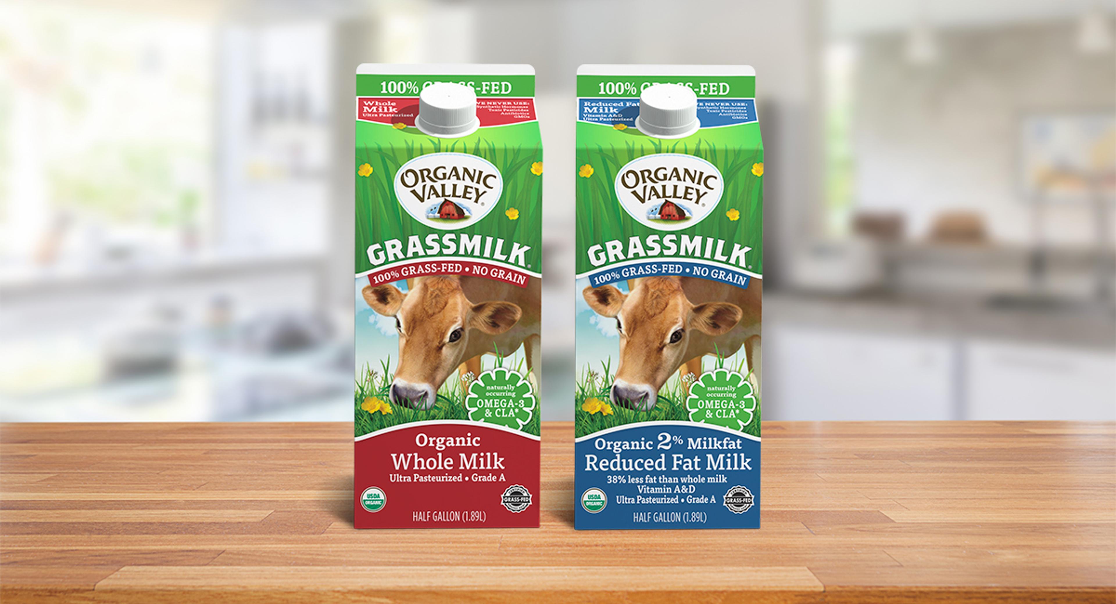 Organic Grassmilk Milk displayed on a table.