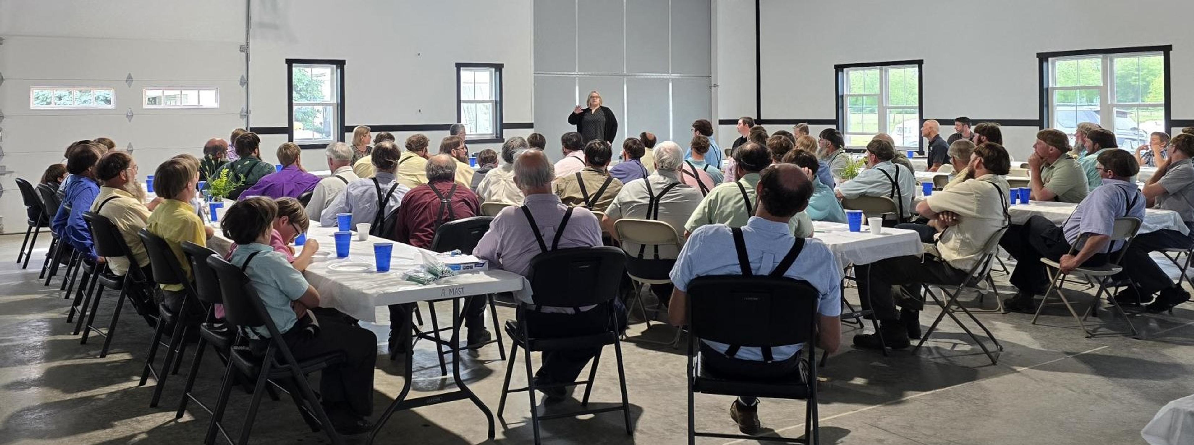 Farmers gather in a meeting room.