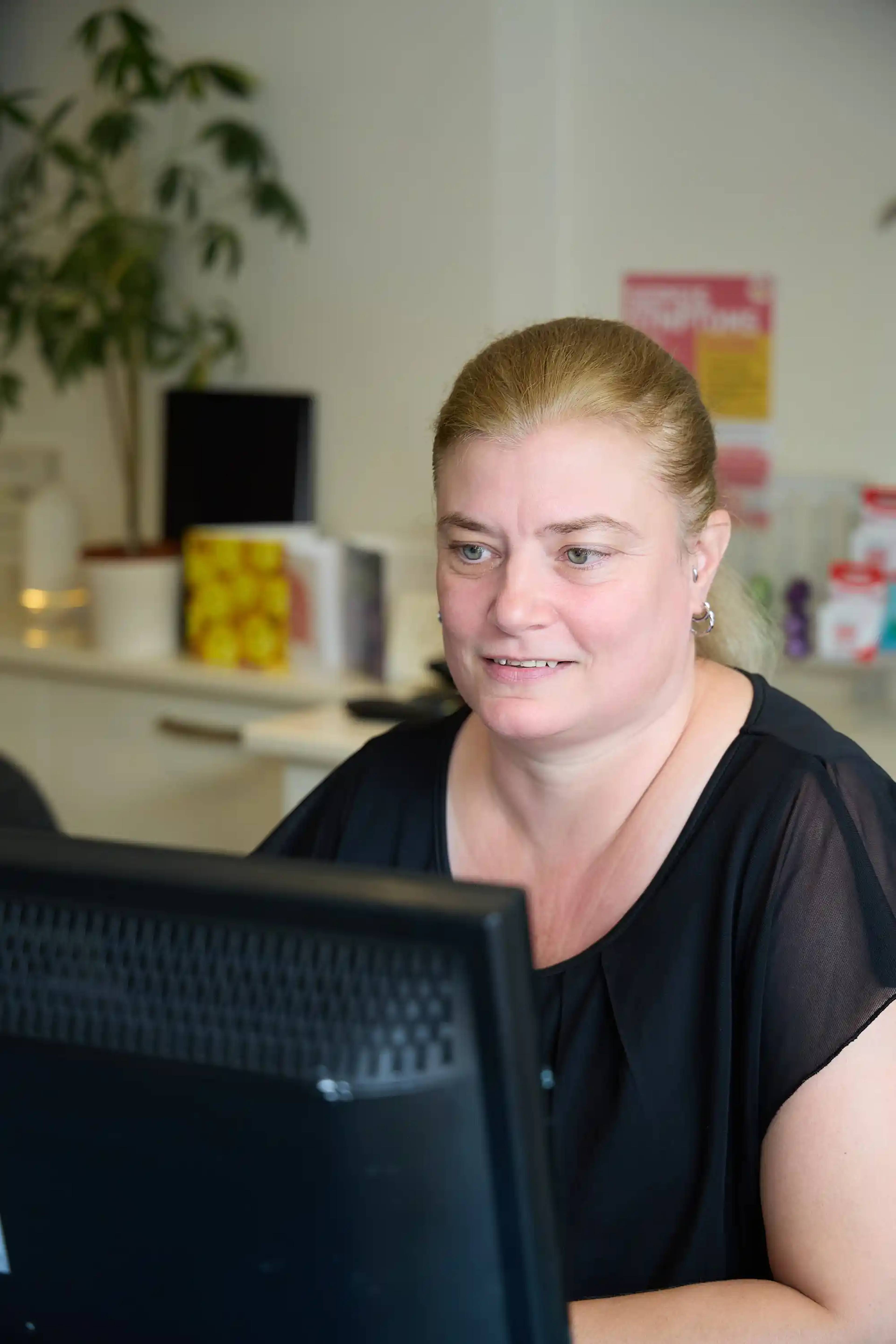 Bath Spa Dentistry team member discussing a dental membership plan and patient care options during a consultation.
