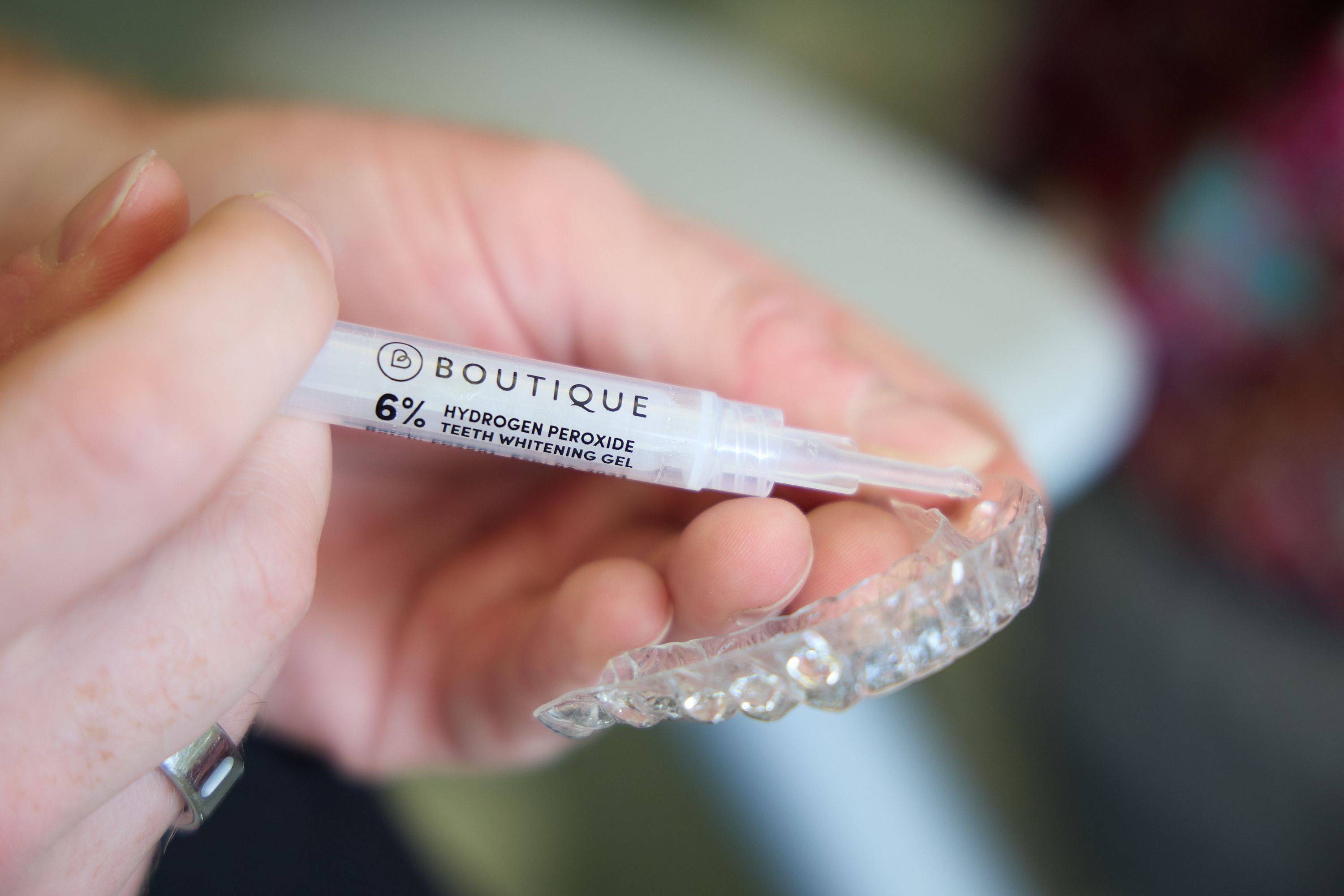 Close-up of Boutique Whitening teeth whitening gel being applied to a custom whitening tray at Bath Spa Dentistry.