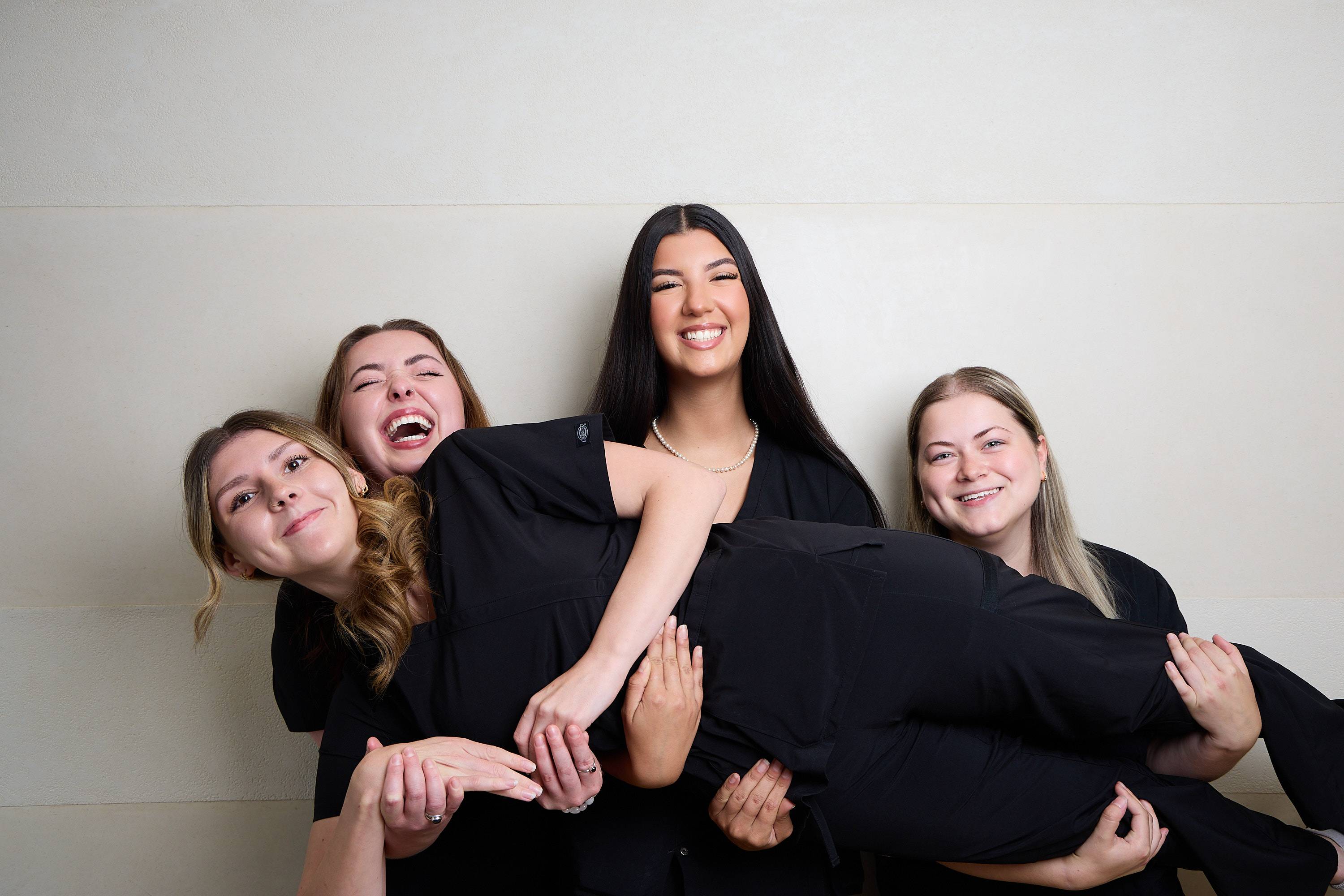 Bath Spa Dentistry team members posing for a fun and informal group photo inside the practice.