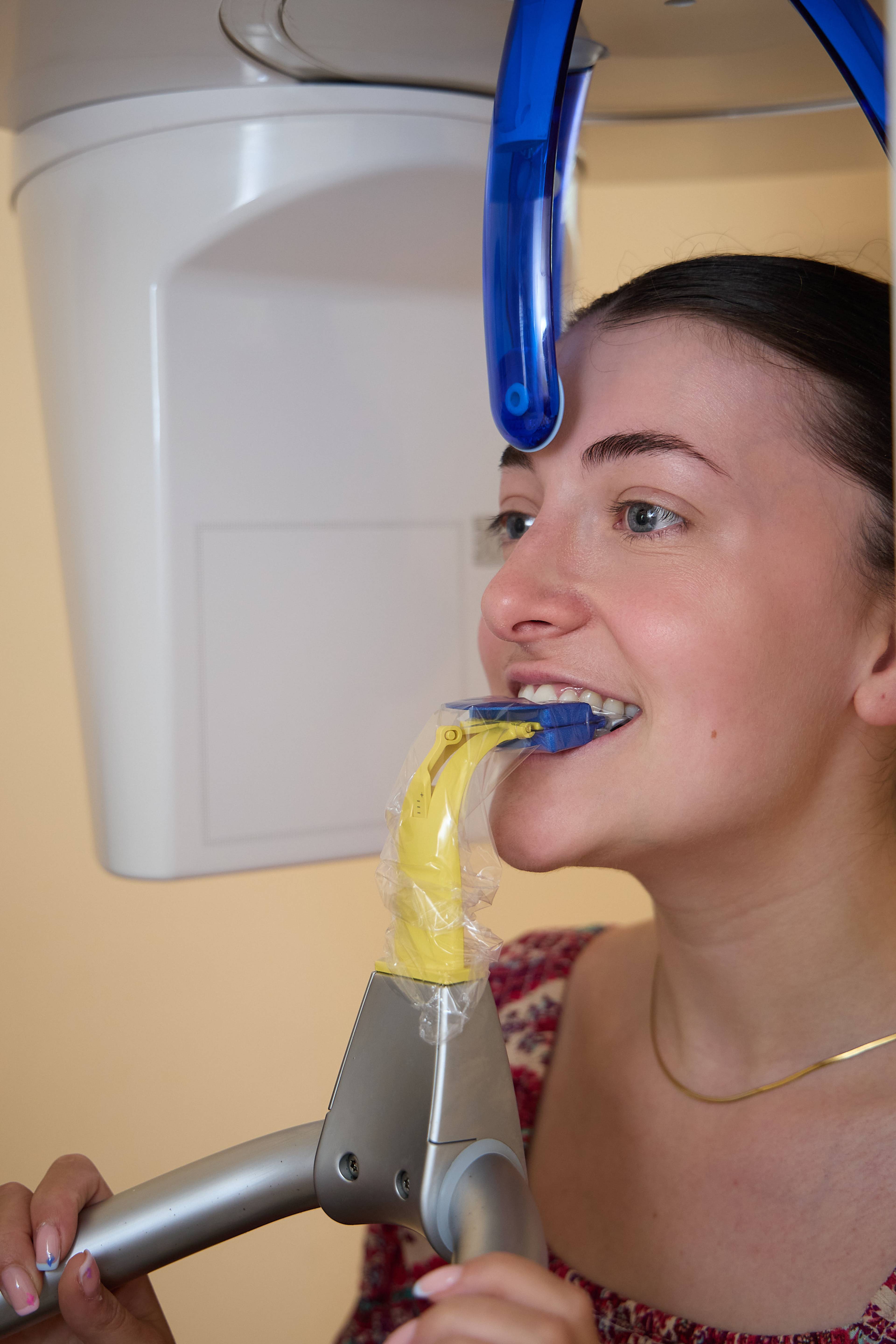 Patient undergoing a digital dental X-ray scan using panoramic imaging equipment at Bath Spa Dentistry.