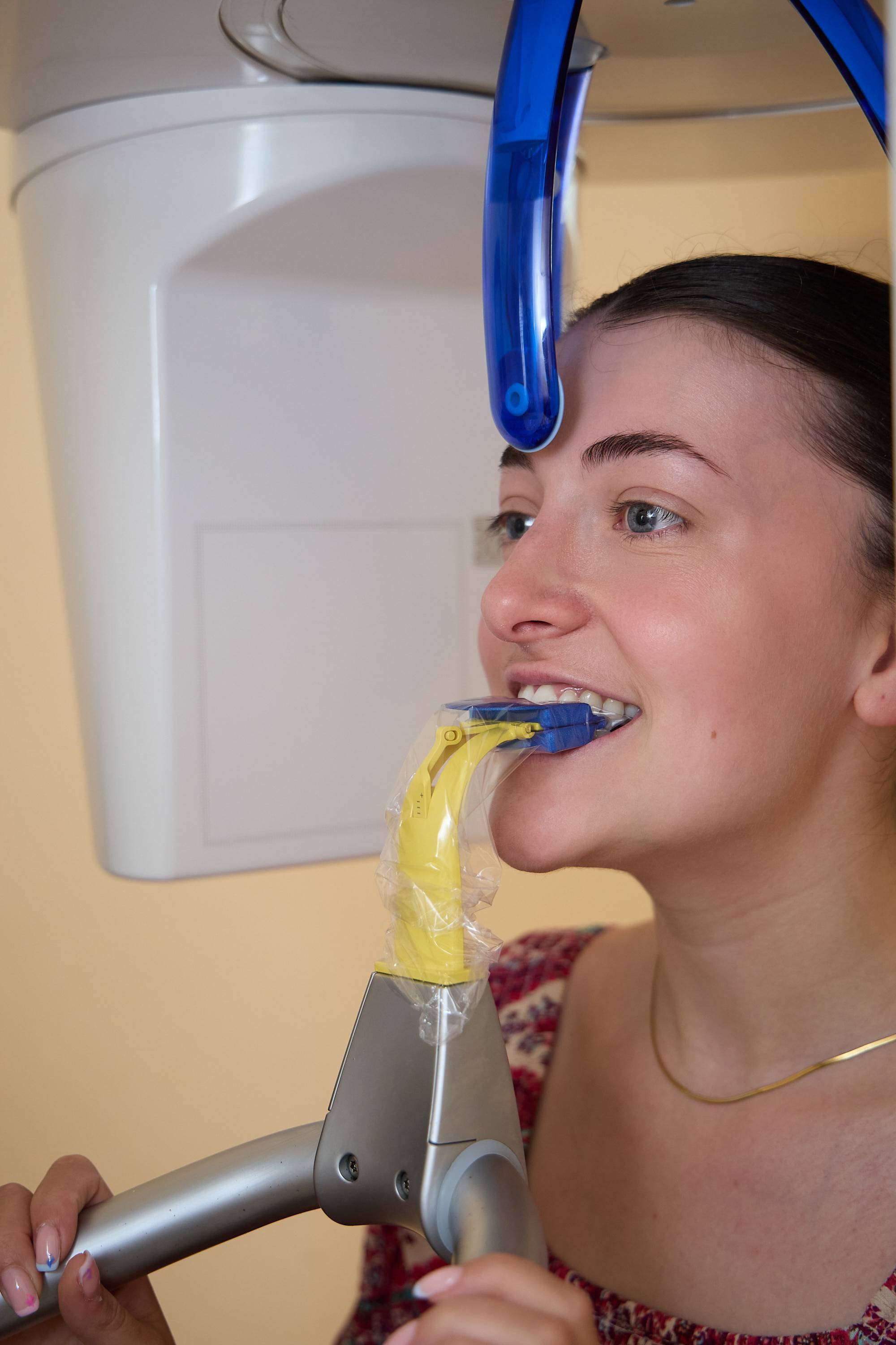 Patient undergoing a digital dental X-ray scan using panoramic imaging equipment at Bath Spa Dentistry.