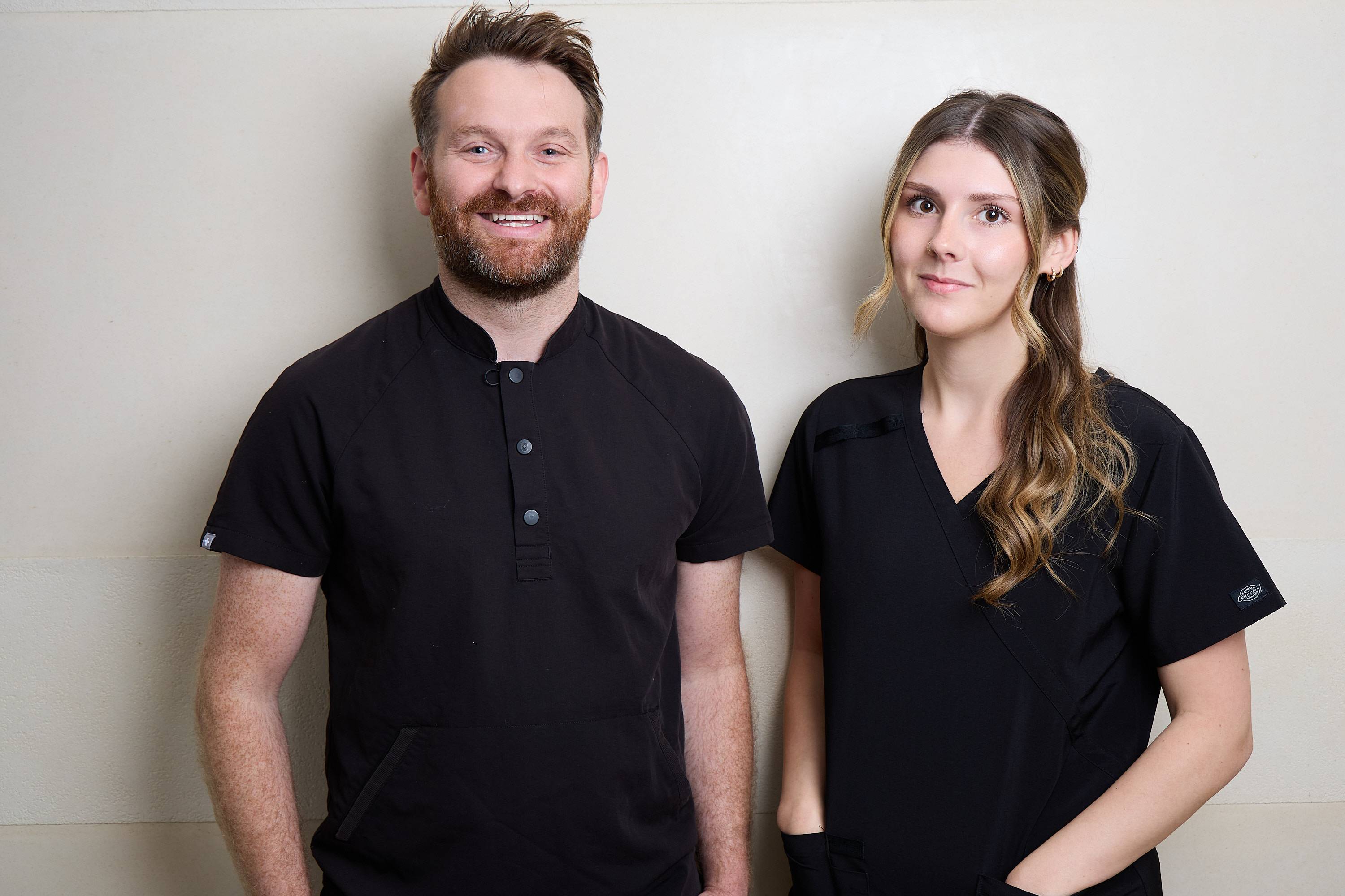 Dental team members at Bath Spa Dentistry standing together in clinical uniforms.