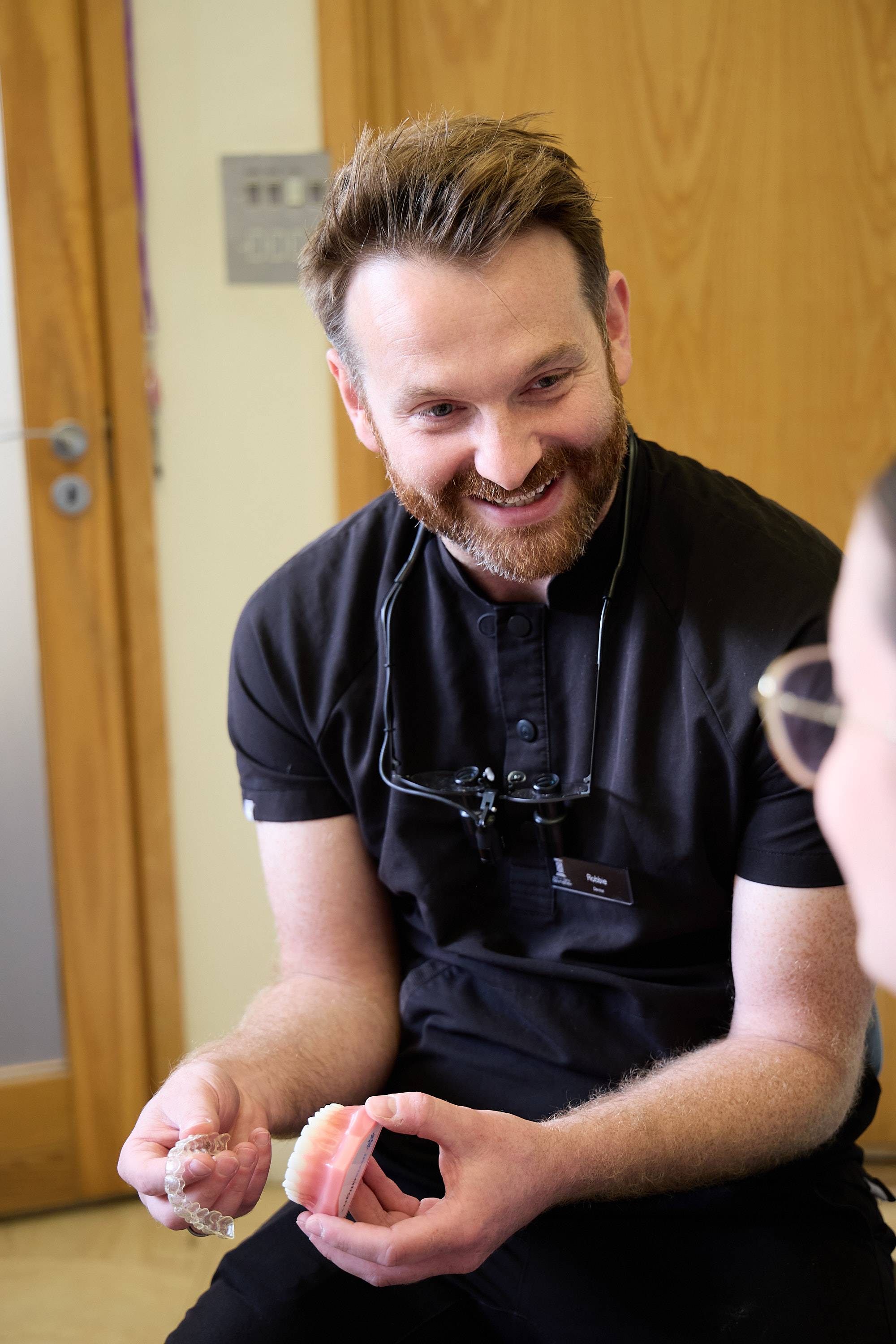 Patient discussing facial aesthetics and treatment planning with a dental professional during a consultation at Bath Spa Dentistry.