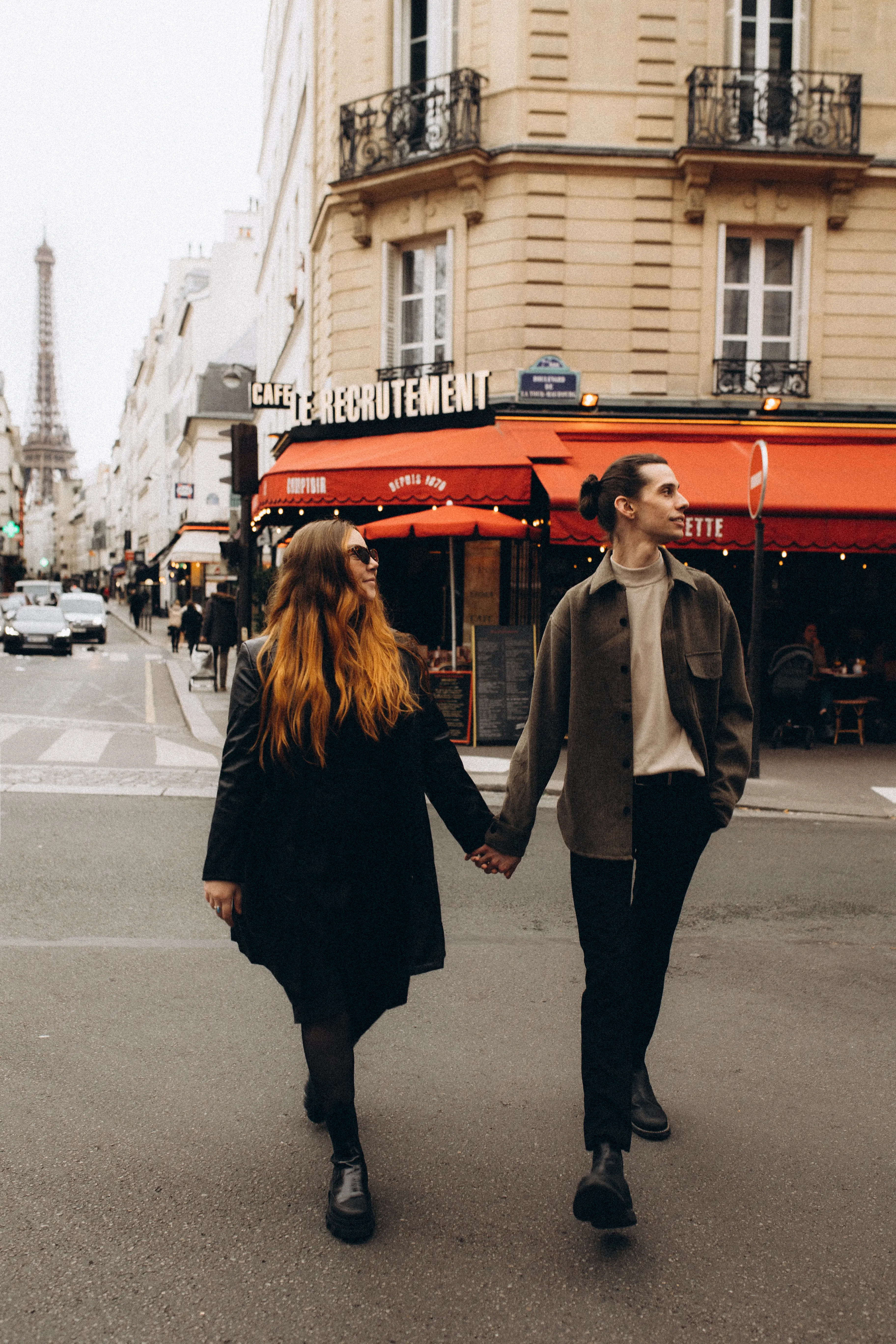 Austin + Emily walking the streets of Paris holding hands