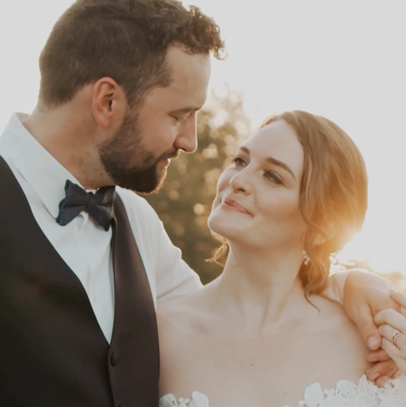 Lauren and Trevor share a romantic glance at golden hour