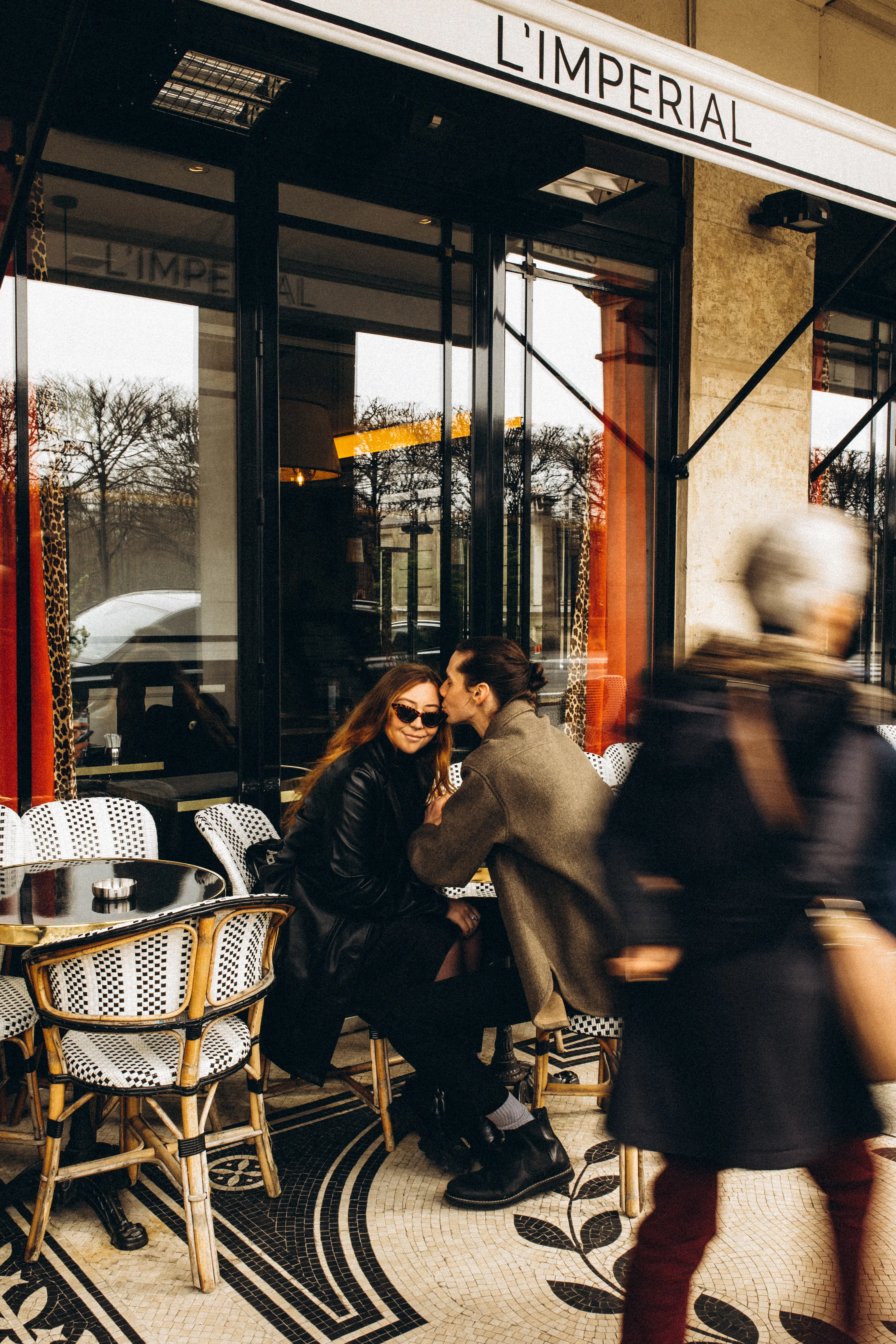 Austin + Emily at a cafe in Paris