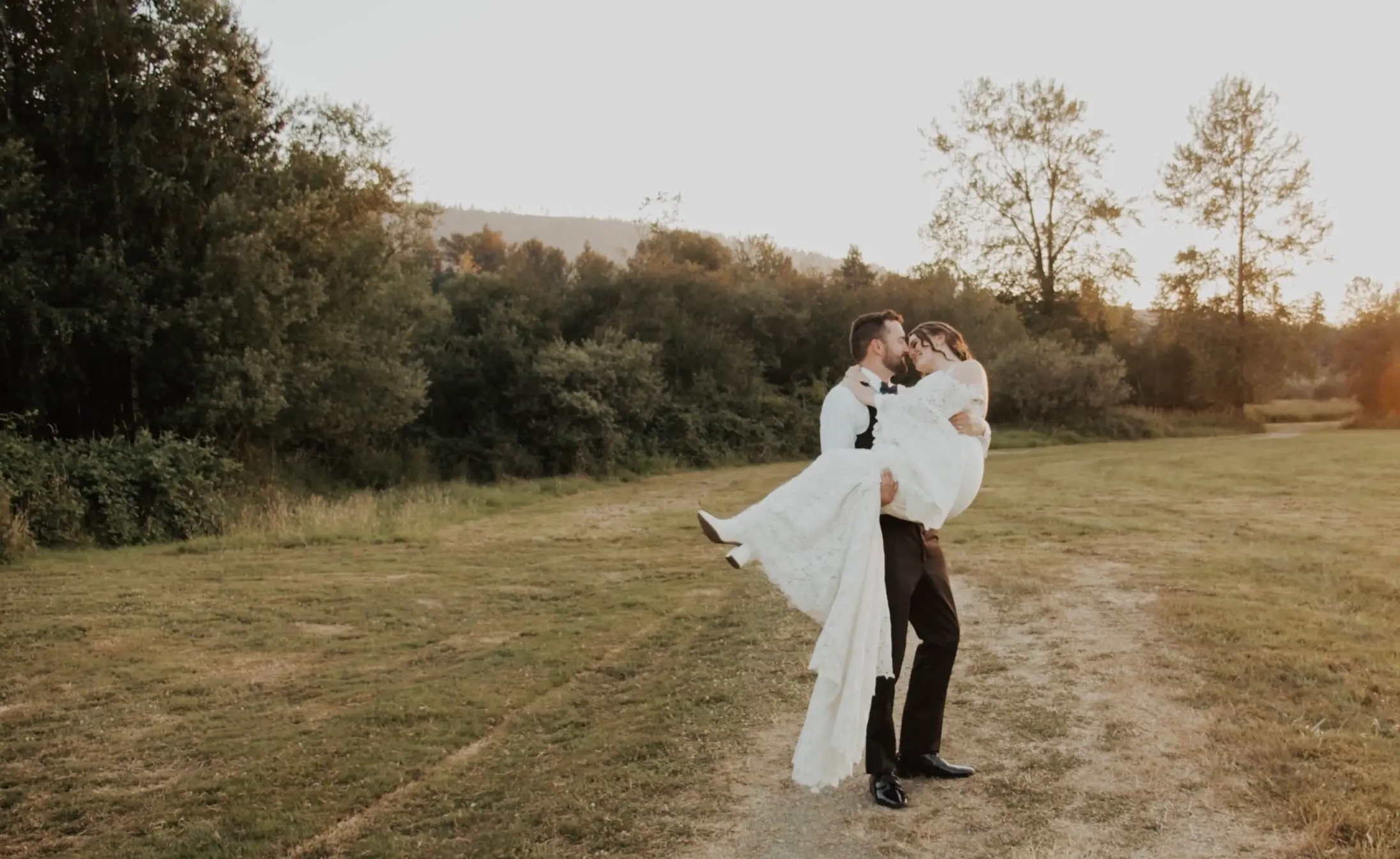 Trevor picks up Lauren for a "bride carry" and turns to leave with her