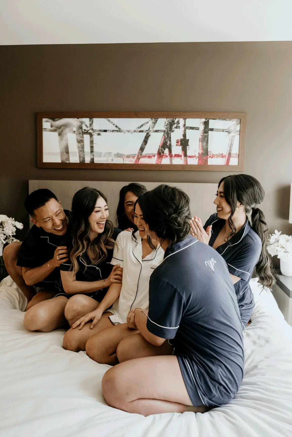 Mai giggles as her bridesmaids shower her with love