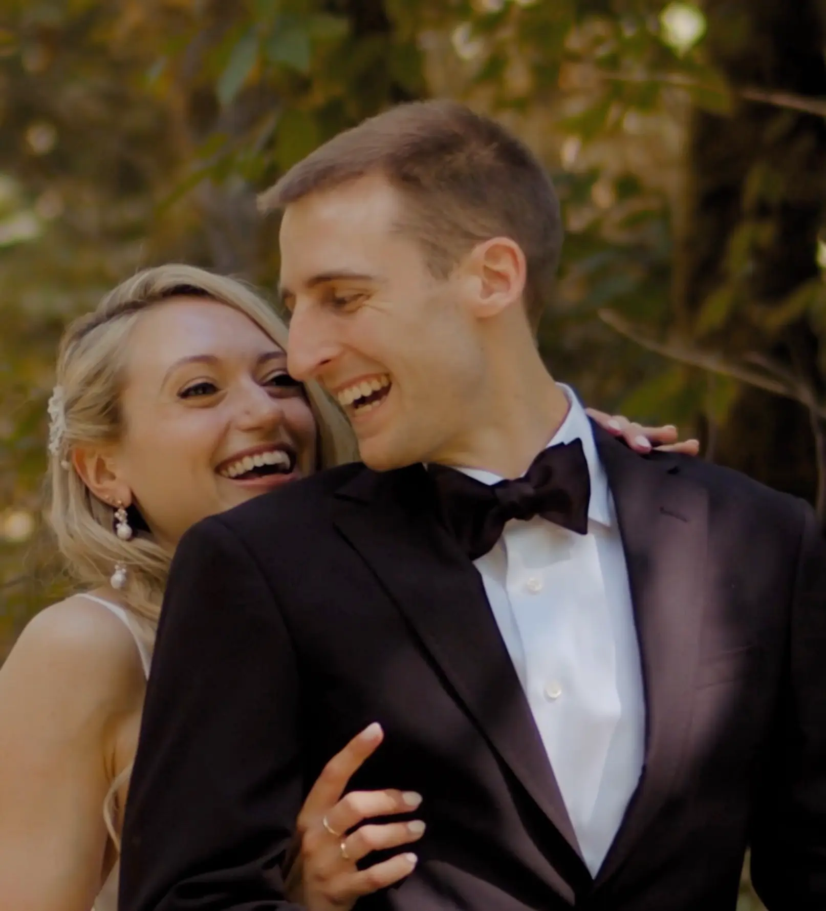 Lauren joyfully grabs Andrew as he smiles and turns around for his first look