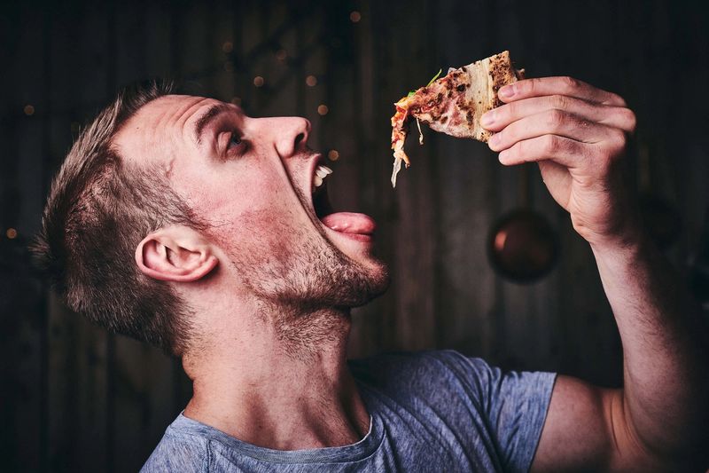 Dropping Pizza into mouth