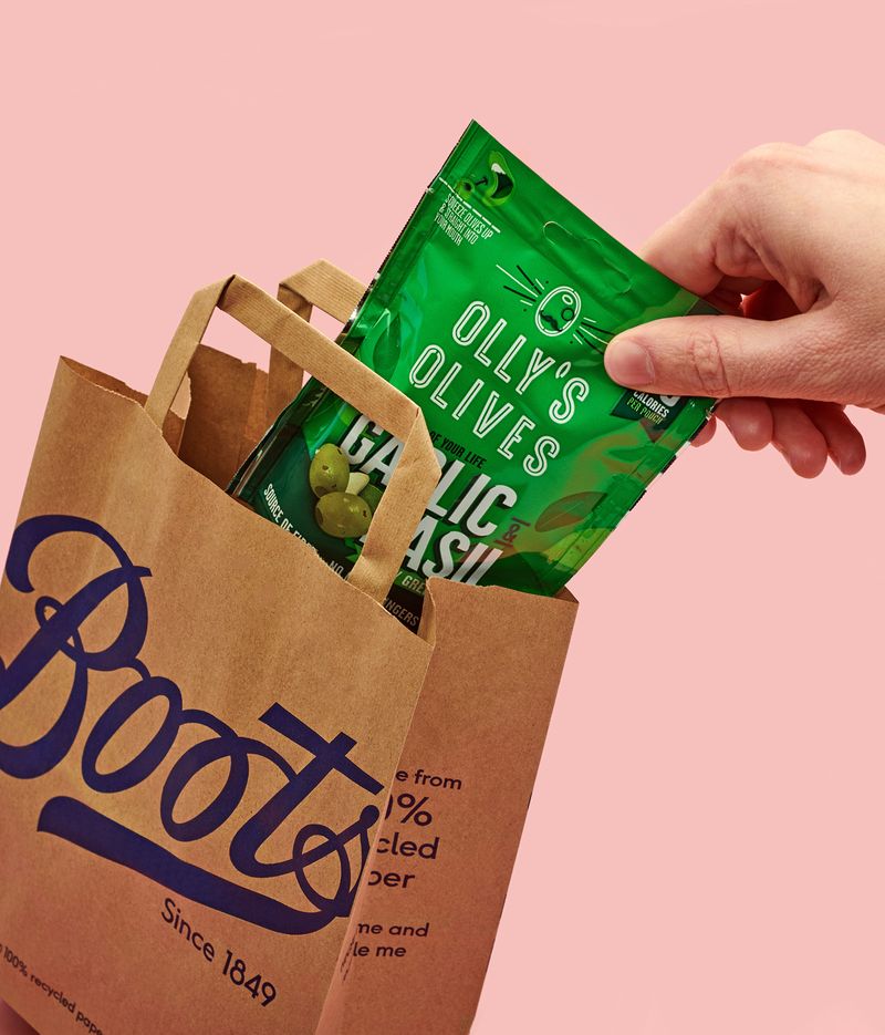 Olly’s olives in a paper Boots bag