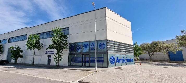 Anticimex building with blue branding and service icons on its windows.