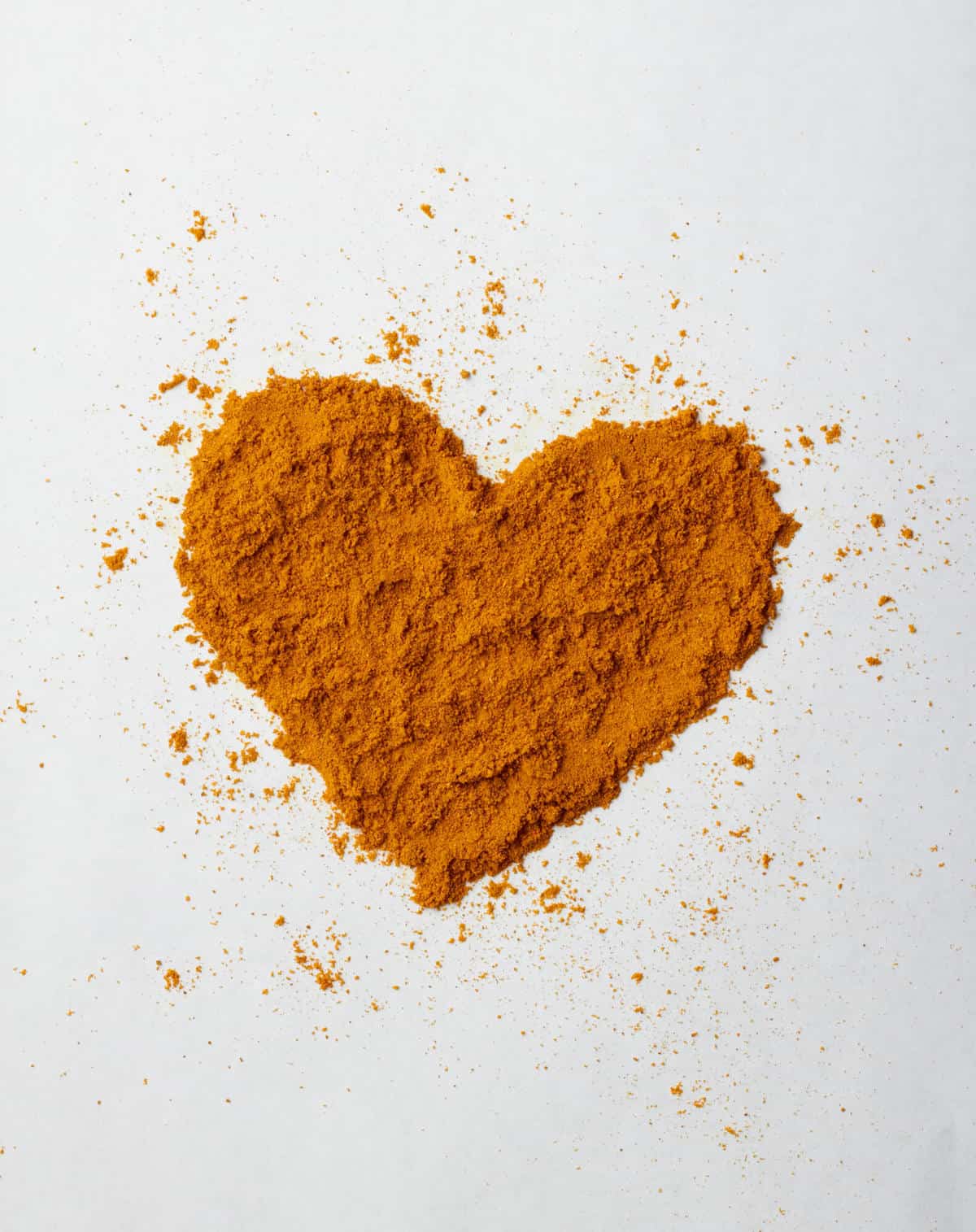 Turmeric powder in a heart shape