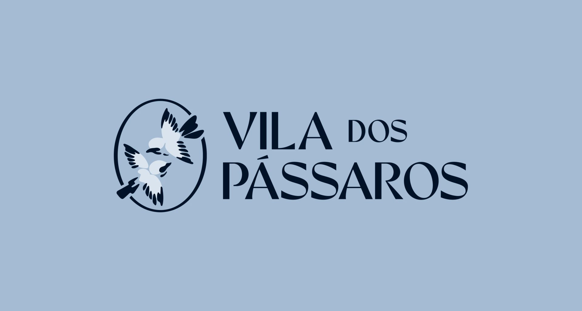 Navy VILA DOS PÁSSAROS logo with two flying birds inside an oval, centered on a pale blue background.