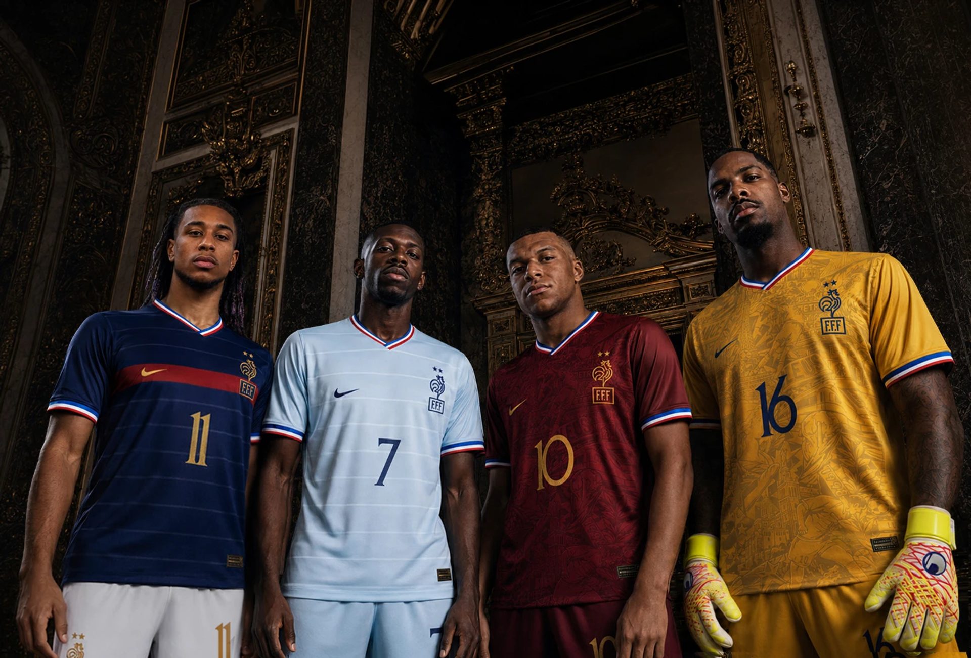 Four footballers wear navy, pale blue, burgundy and gold FFF kits with numbers 11, 7, 10 and 16 in an ornate interior.