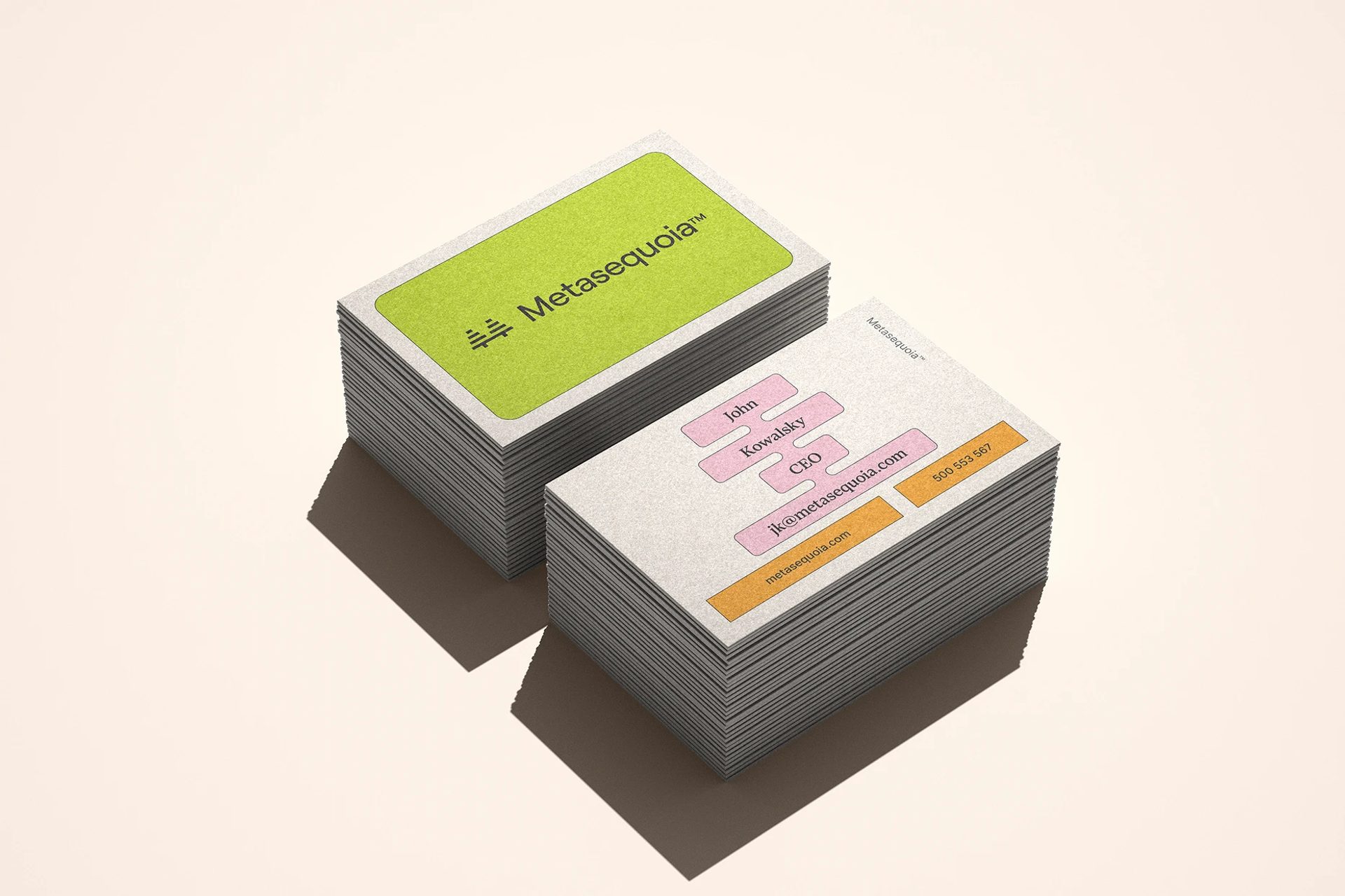 Two stacks of Metasequoia™ business cards feature a lime green logo front and pink and orange contact labels on white.