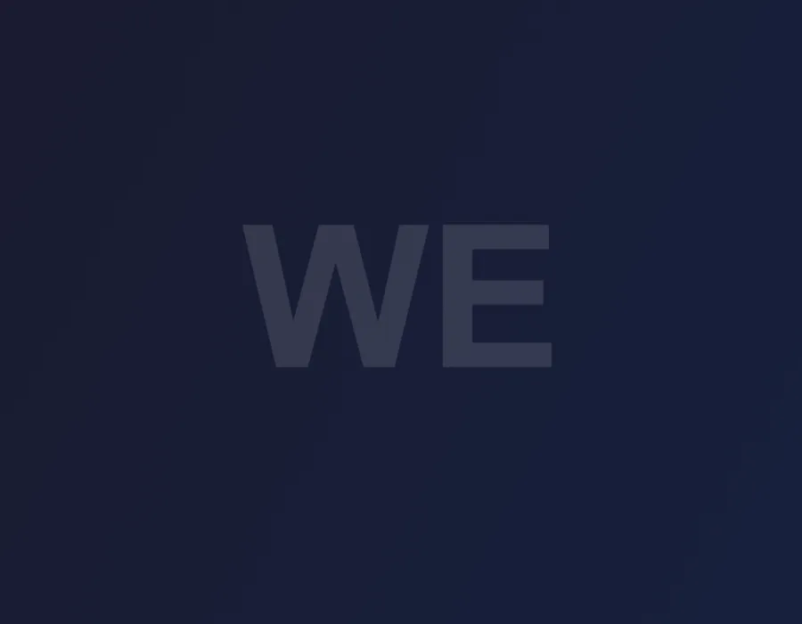 Close-up of serif letterforms from a luxury fashion logotype, showing fine hairline strokes and high-contrast type detailing