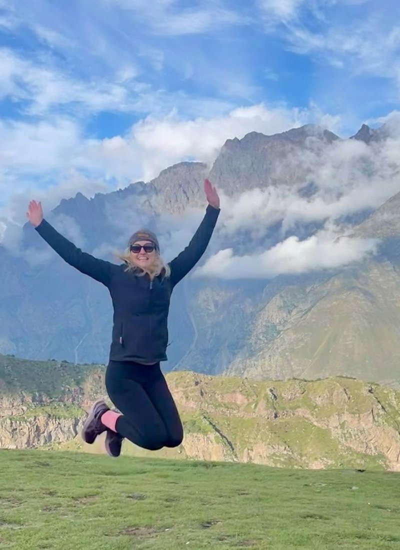 Jen jumping for joy during a hike in Georgia