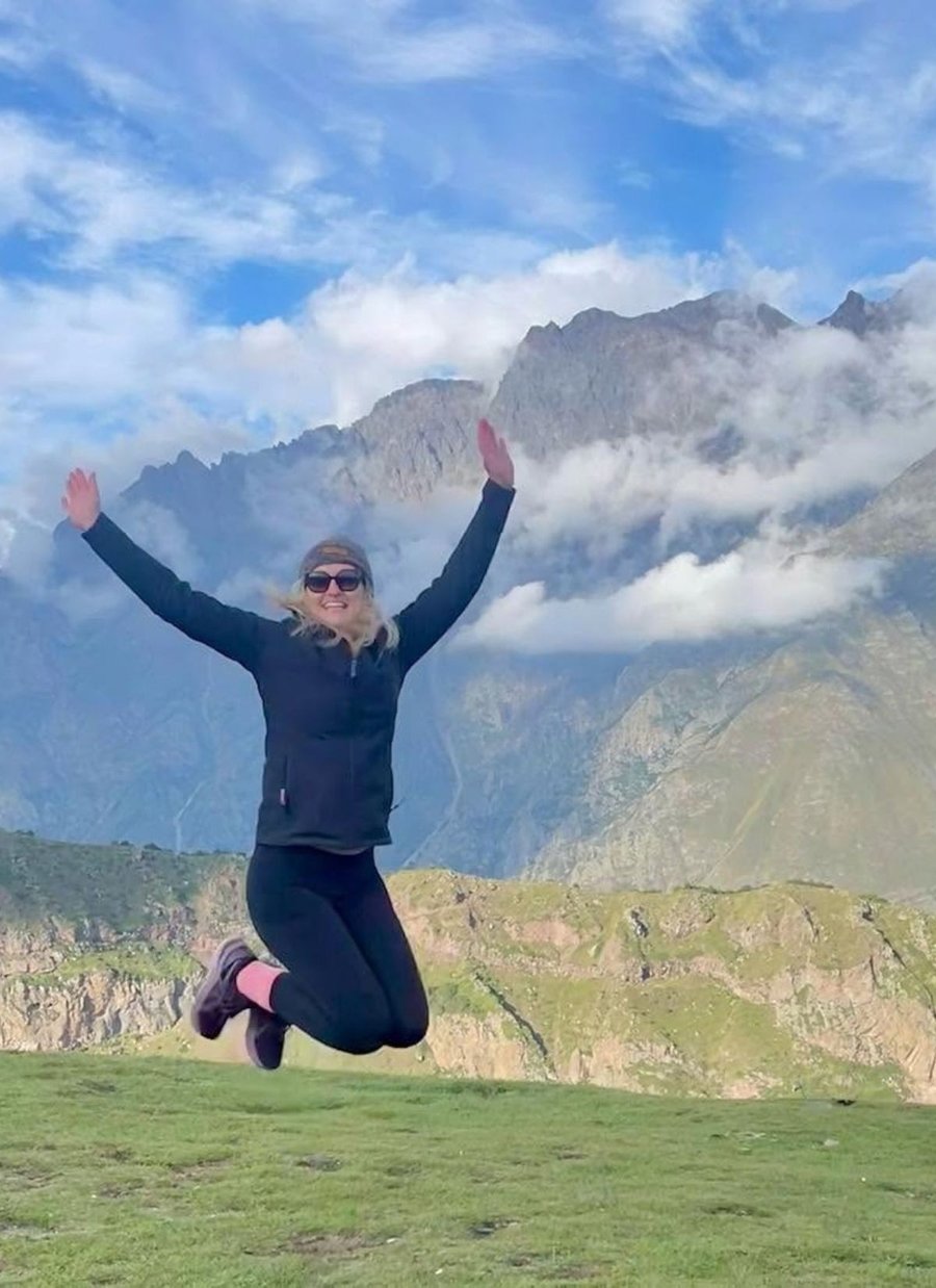 Jen jumping for joy during a hike in Georgia