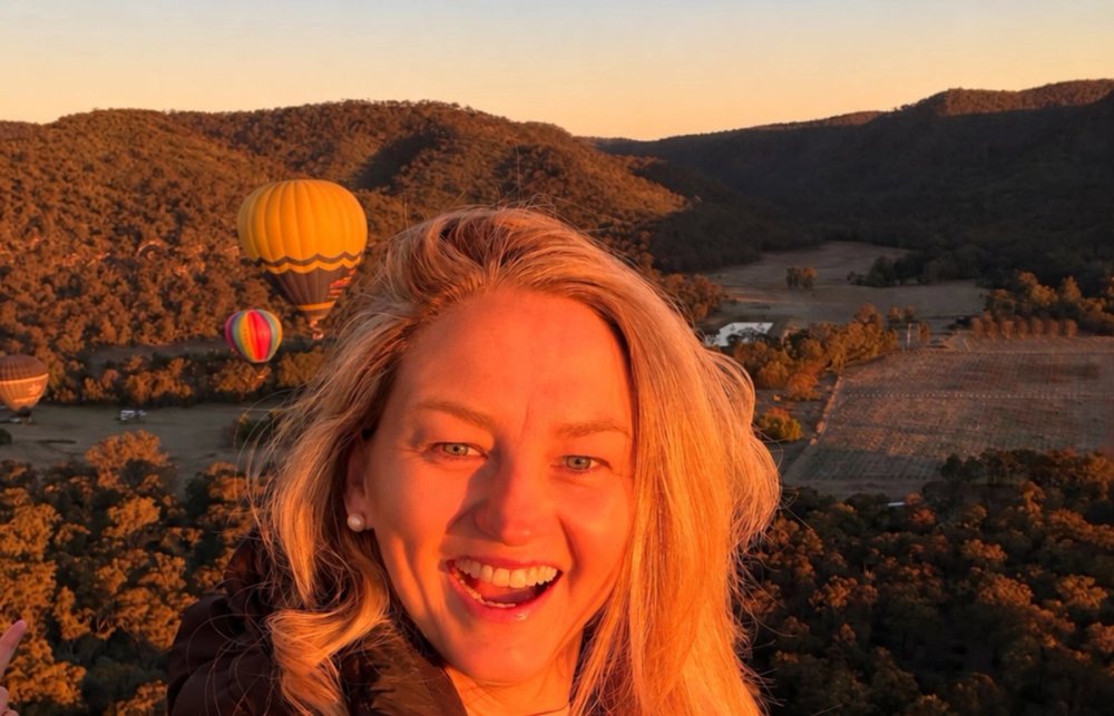 Jen in a hot air balloon overlooking the Hunter Valley