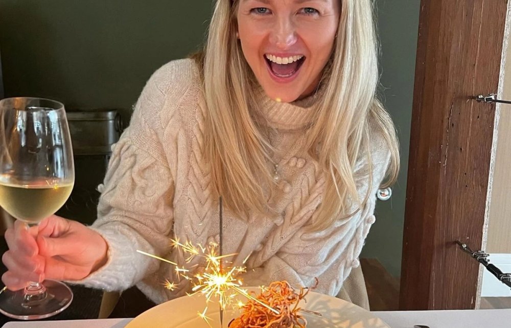 Jen with a wine and dessert