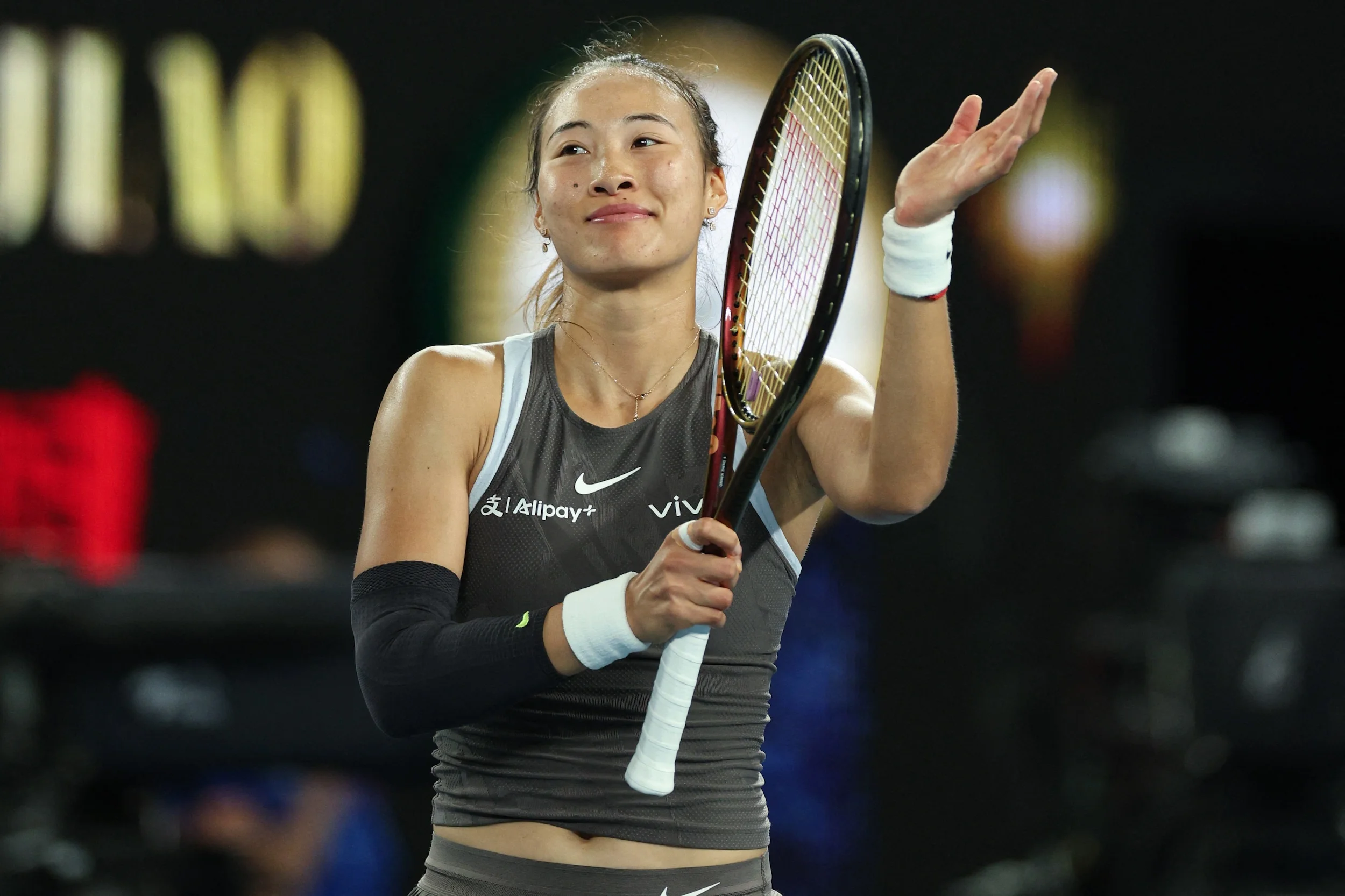 Qinwen Zheng overcomes early nerves to kicstart Australian Open challenge