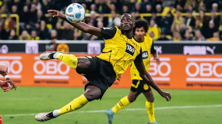 Guirassy's late strike secures a vital victory for Dortmund against St. Pauli.