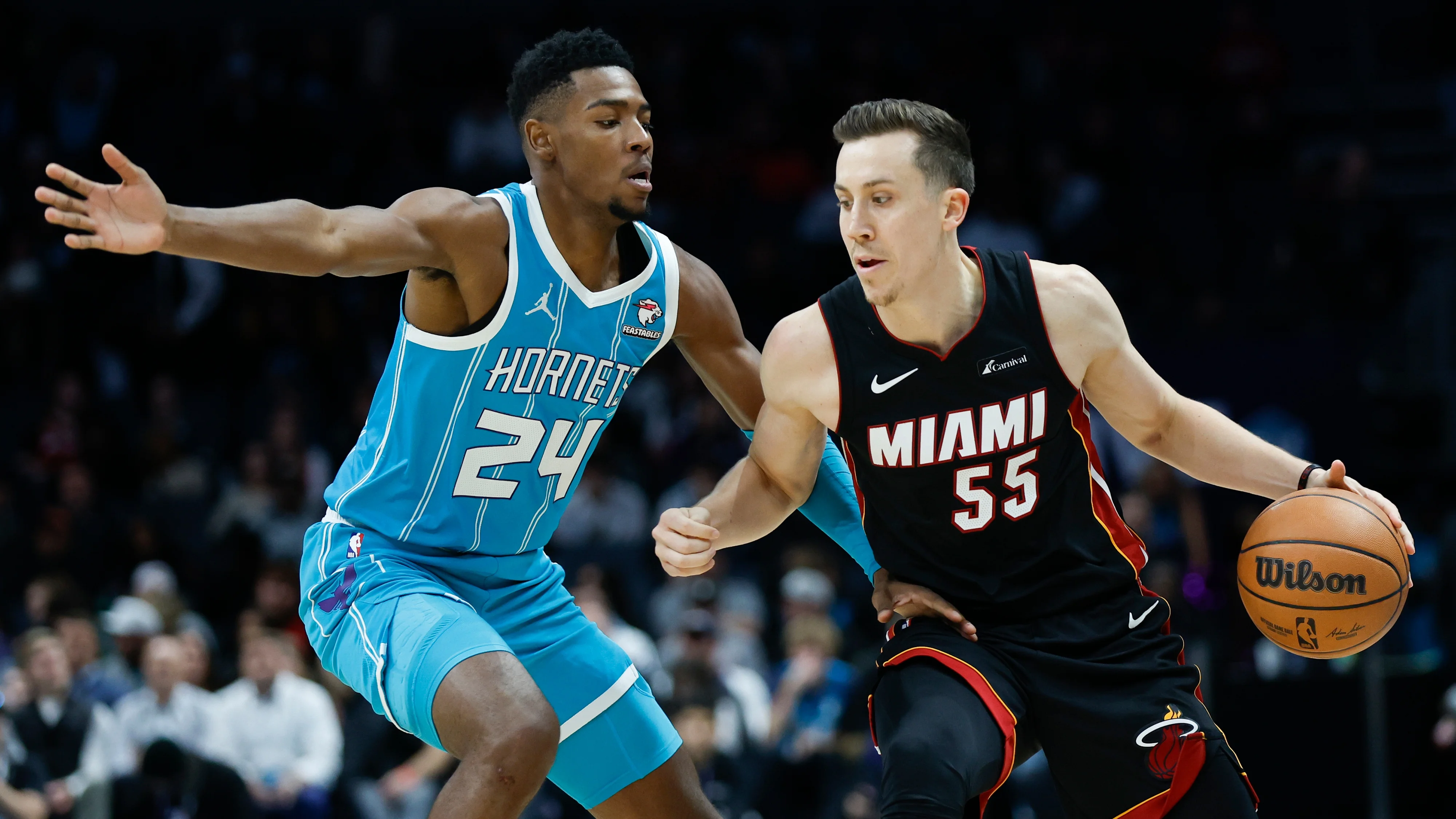 Robinson, Heat hold on to top Hornets 116-114