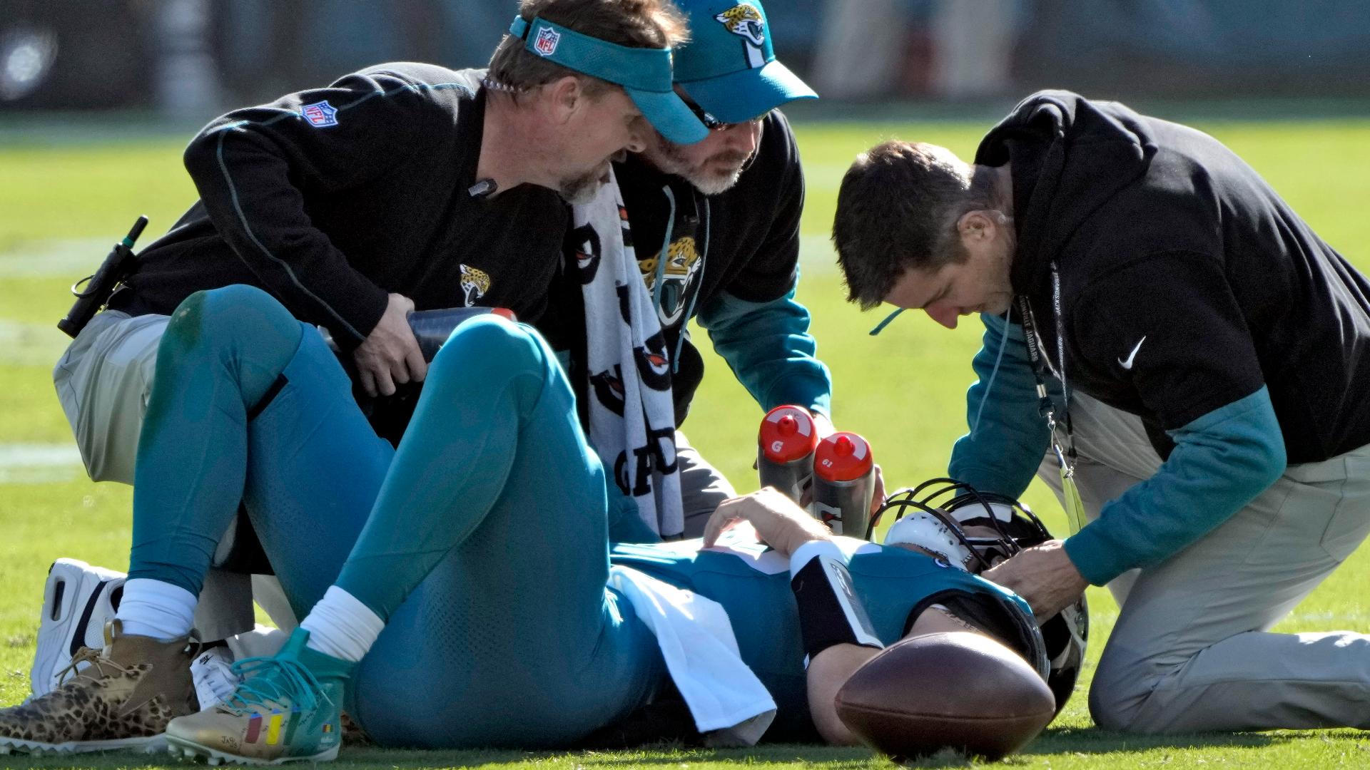 Jaguars quarterback Trevor Lawrence departs game with concussion following hard hit.