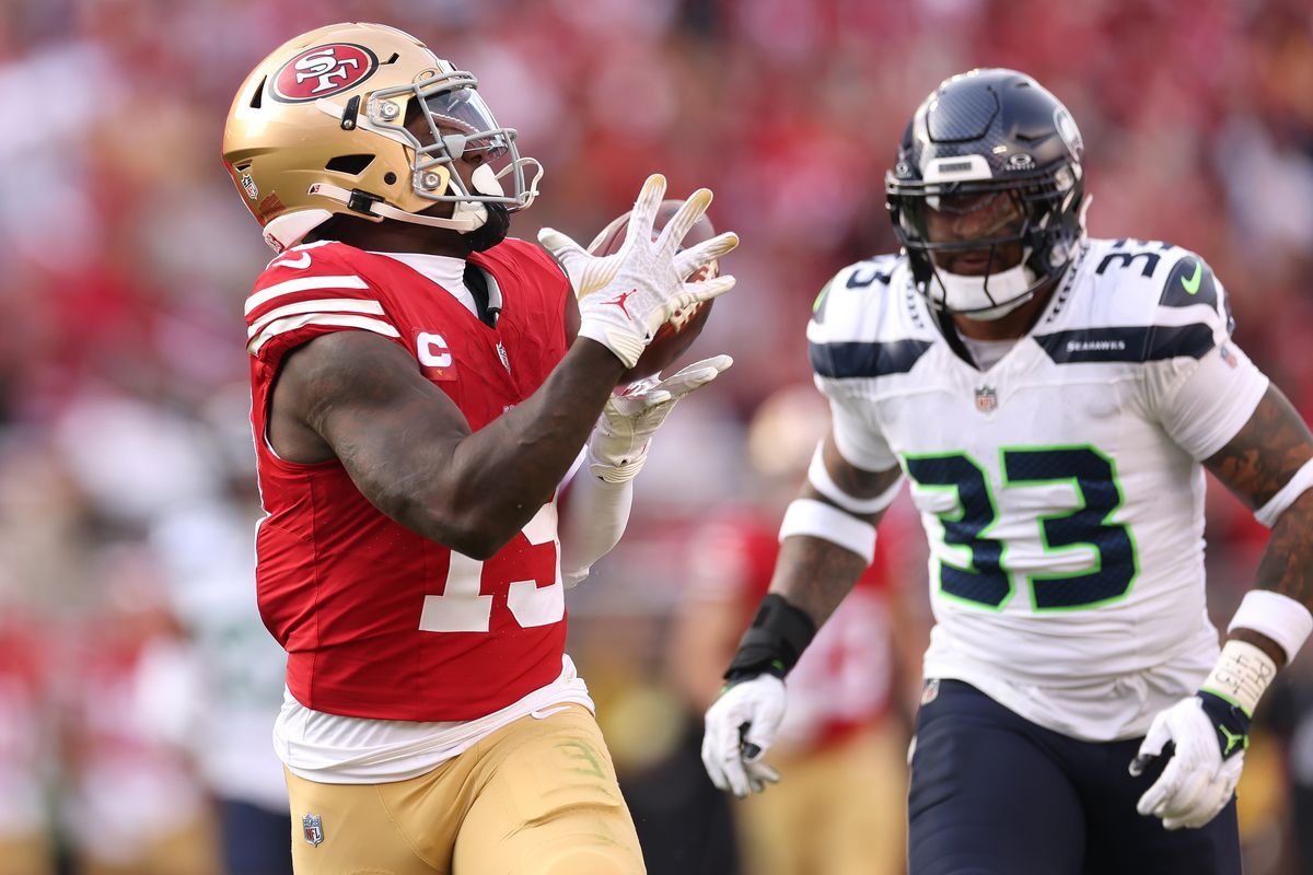 Brock Purdy throws for a career-high 368 yards and Deebo Samuel scores two TDs as the 49ers defeat the Seahawks 28-16.
