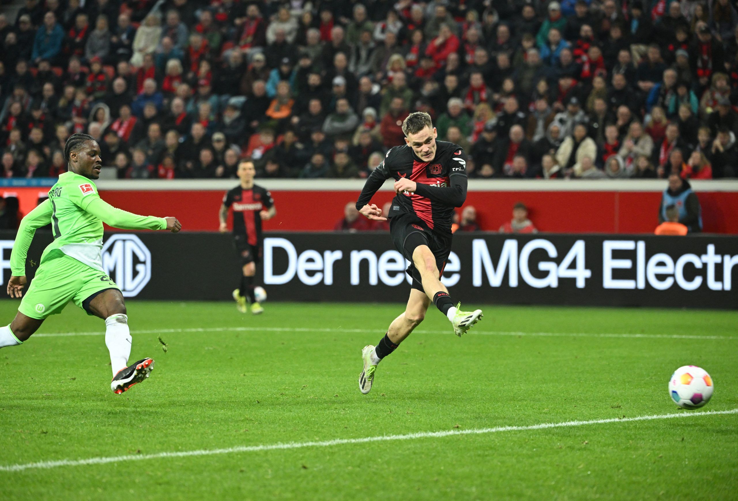 Bayer Leverkusen 2-0 VfL Wolfsburg: League leaders cruise past 10-man visitors to maintain lead at the top of the table