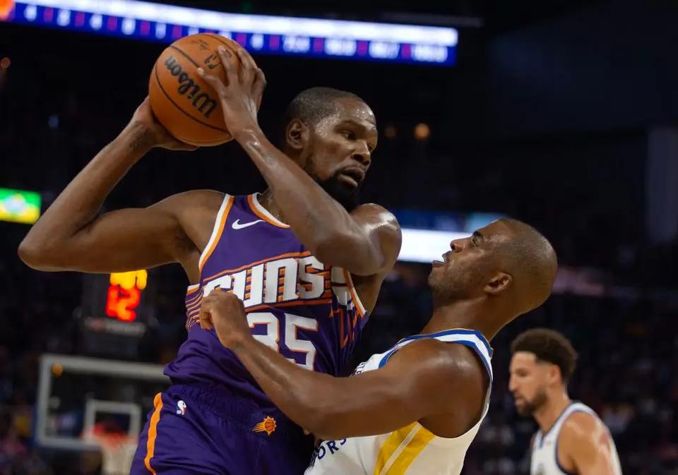 Suns beat Warriors in season opener as Kevin Durant receives a video tribute in his return to Golden State.