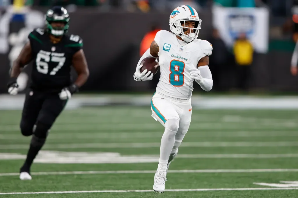 Holland scores 99-yard Hail Mary pick-six as Dolphins defeat Jets 34-13