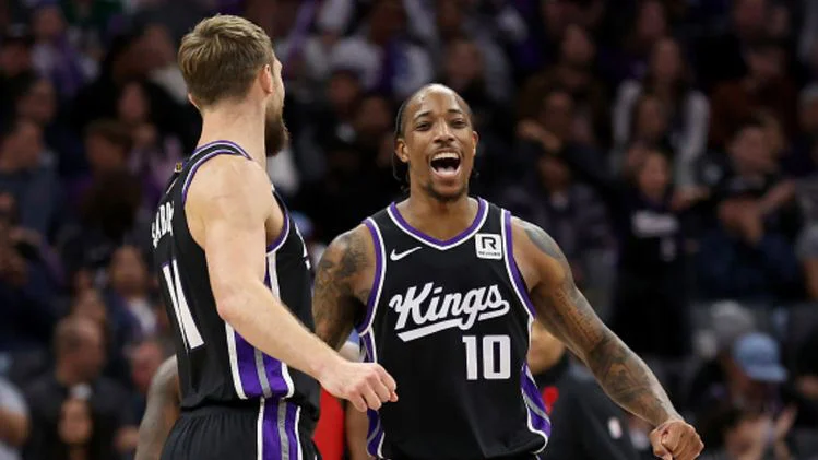 DeMar DeRozan scores 27 points, leading the Kings past the Raptors 122-107