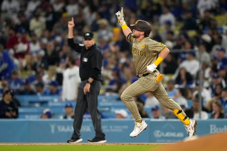 Padres secure postseason berth with a 4-2 victory over the NL West-leading Dodgers in opener of pivotal series